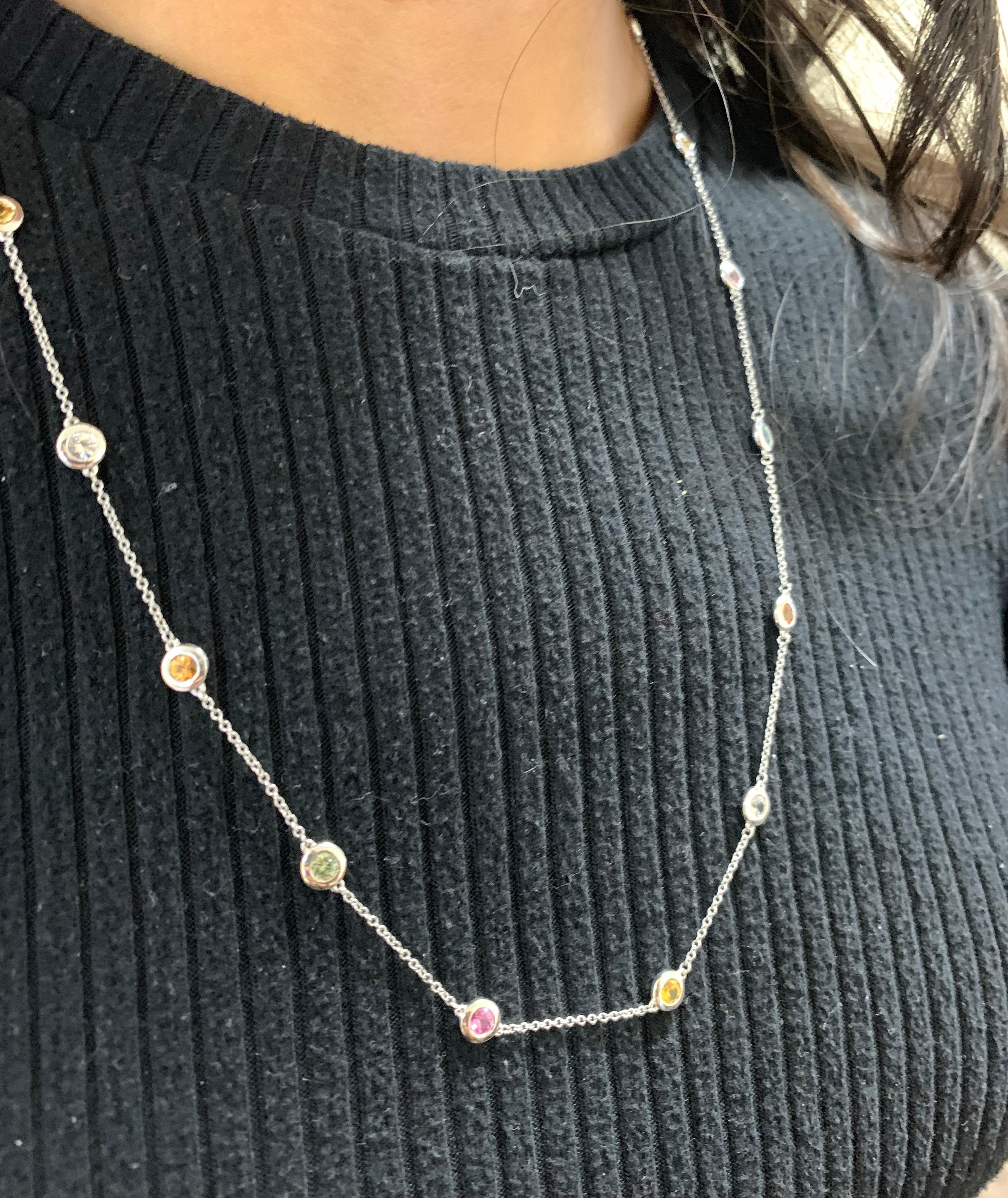 Stones: 13 Round Multicolor Sapphire at 2.62 Carats Total Weight
Accent Stones: 4 Round White Sapphires at 0.76 Carats Total Weight
Metal: 14K White Gold

Fine one-of-a-kind craftsmanship meets incredible quality in this breathtaking piece of