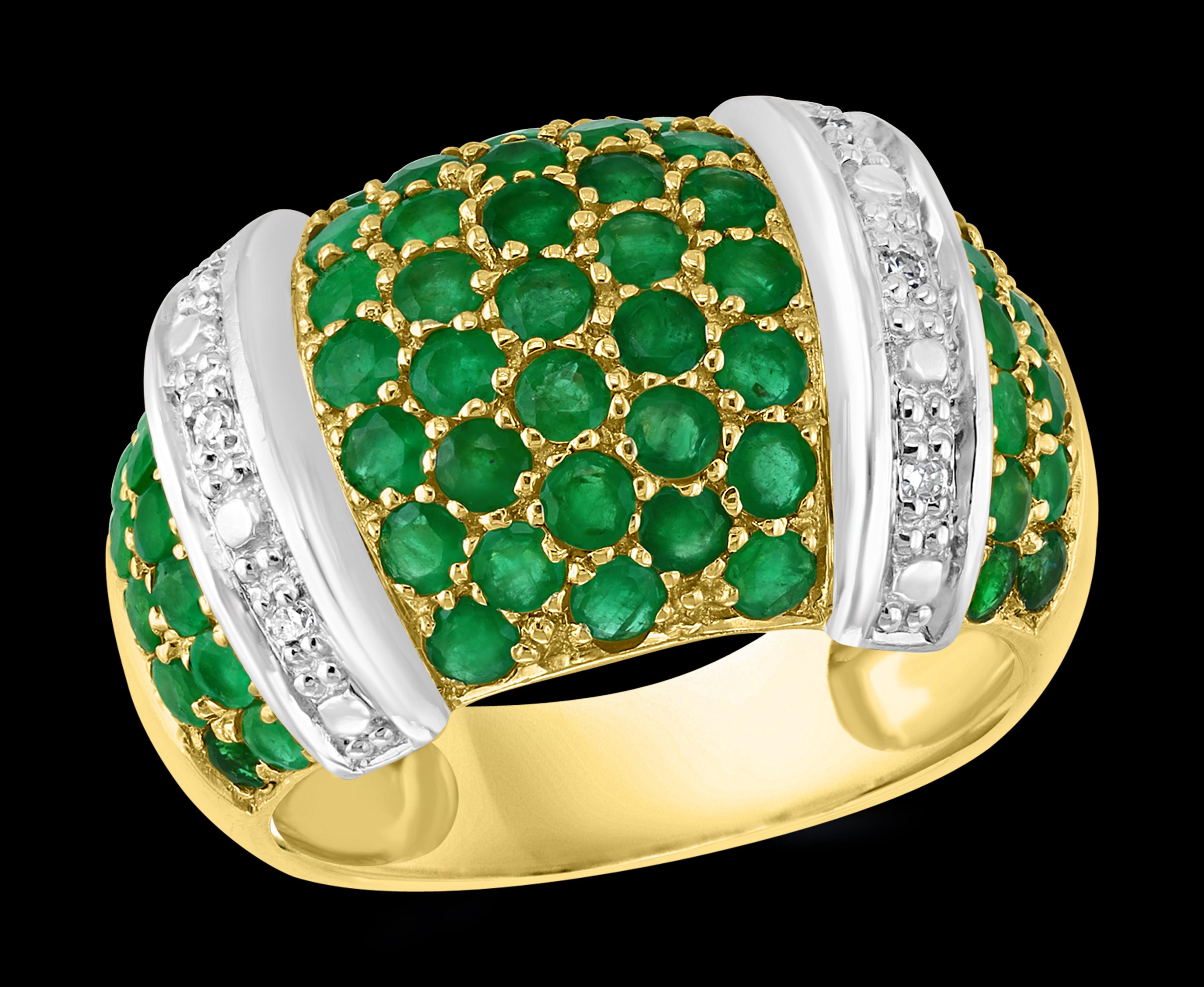 
 Round  Emerald  & Diamond  Cocktail Ring  14 Karat Yellow Gold Size 8.5
  There are Several round  shape emerald stones set  with two bars of diamonds
 Emeralds are very precious , Very Difficult to find and getting more more difficult to find.
14