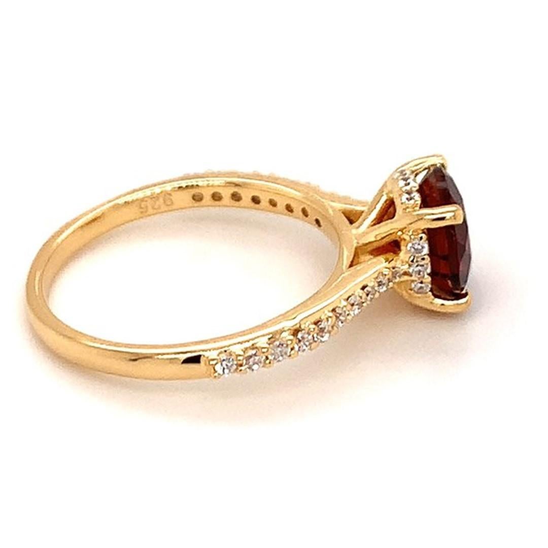 Round Shape Garnet Gemstone And CZ beautifully crafted  in a Ring. A fiery Red Color January Birthstone. For a special occasion like Engagement or Proposal or may be as a gift for a special person.

Primary Stone Size - 8x8mm