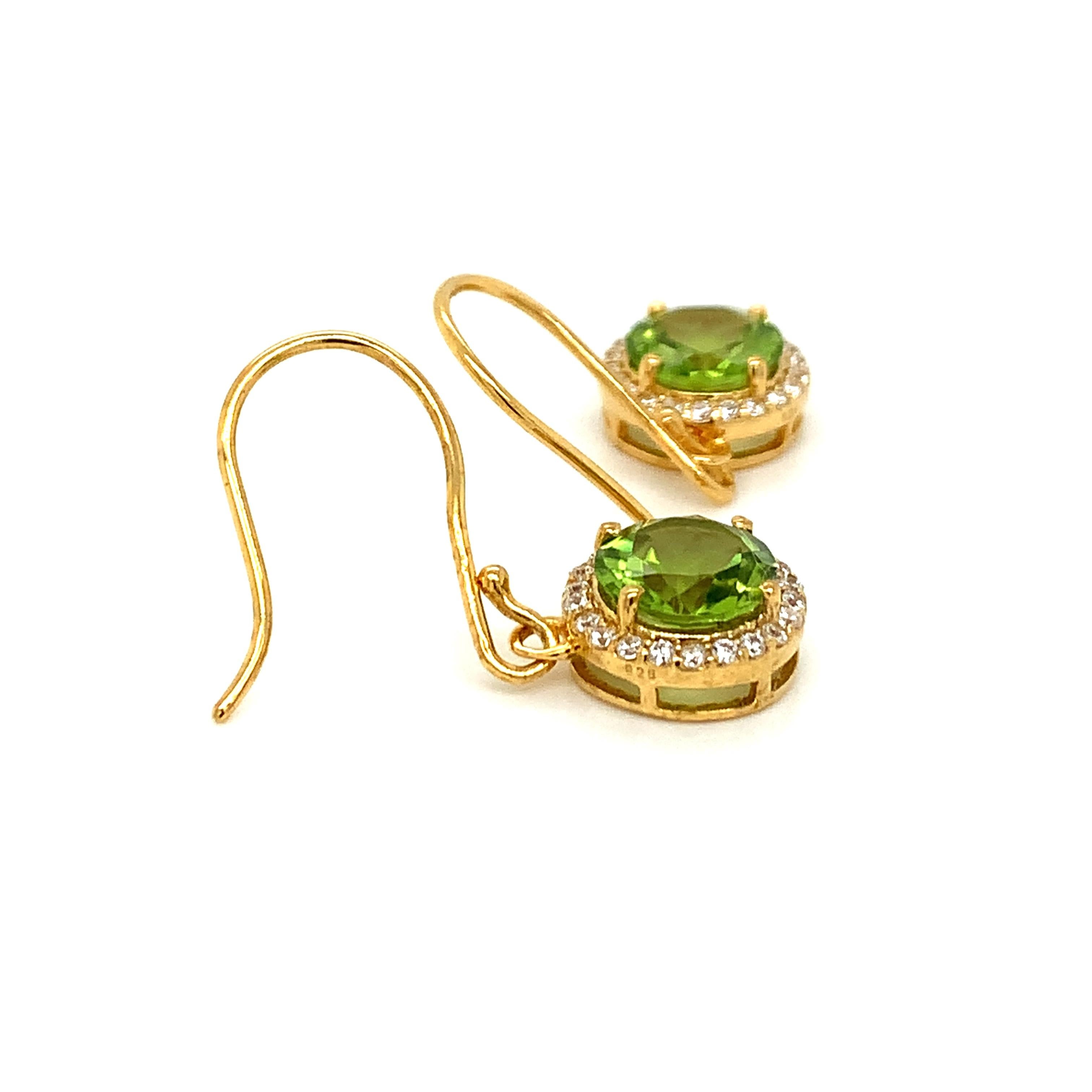 Round Shape Peridot Gemstone And CZ beautifully crafted  in a Earrings. A fiery Green Color August Birthstone. For a special occasion like Engagement or Proposal or may be as a gift for a special person.

Primary Stone Size - 8x8 mm
