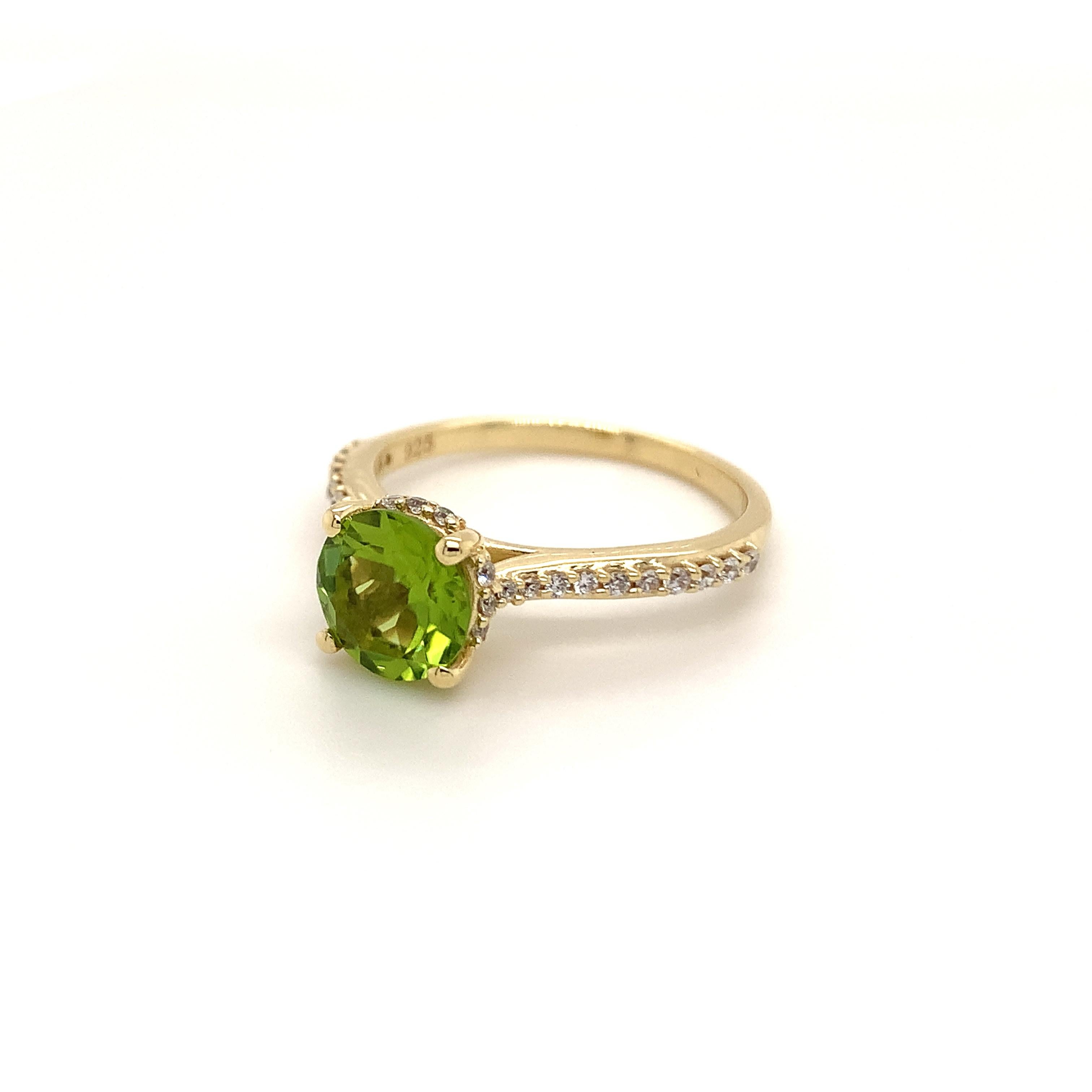 Round Shape Peridot Gemstone And CZ beautifully crafted  in a Ring. A fiery Green Color August Birthstone. For a special occasion like Engagement or Proposal or may be as a gift for a special person.

Primary Stone Size - 8x8mm