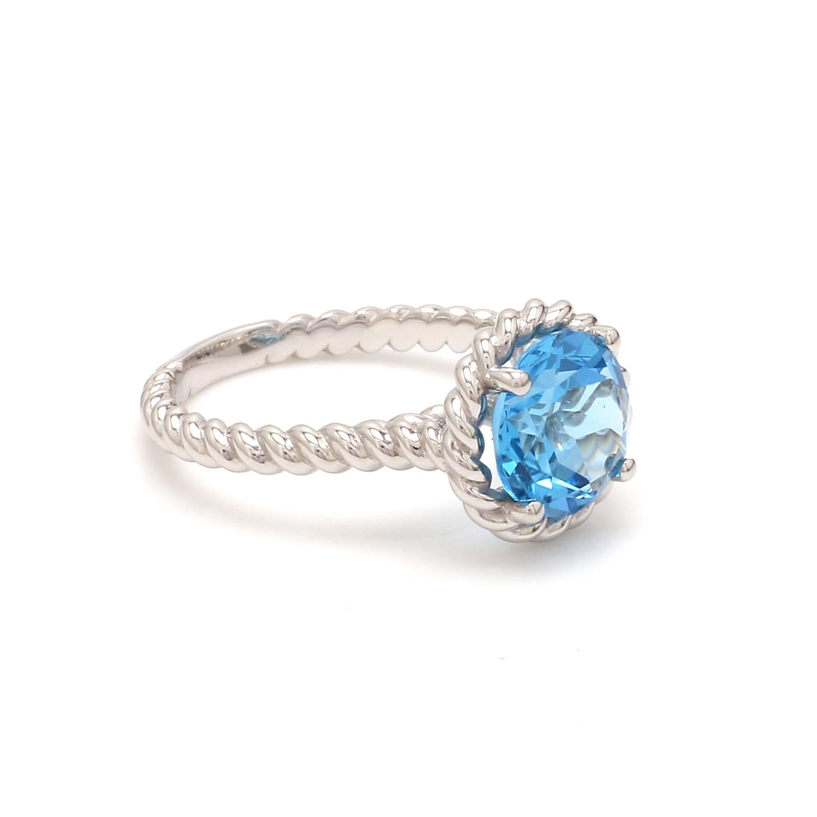 Round Shape Swiss Blue Topaz Gemstone  beautifully crafted  in a Ring. A fiery Blue color December Birthstone. For a special occasion like Engagement or Proposal or may be as a gift for a special person.

Primary Stone Size - 9x9mm