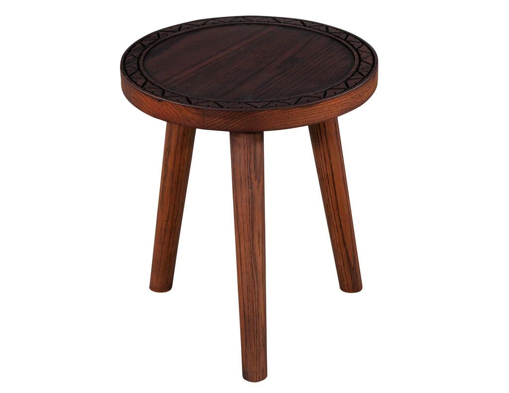 Round Oak Accent table by Ellen Degeneres Villa Drinks Table. Round oak drinks table with unique carved design pattern. Finished in a natural rich satin brown. Price includes complimentary curb side delivery to the continental USA.