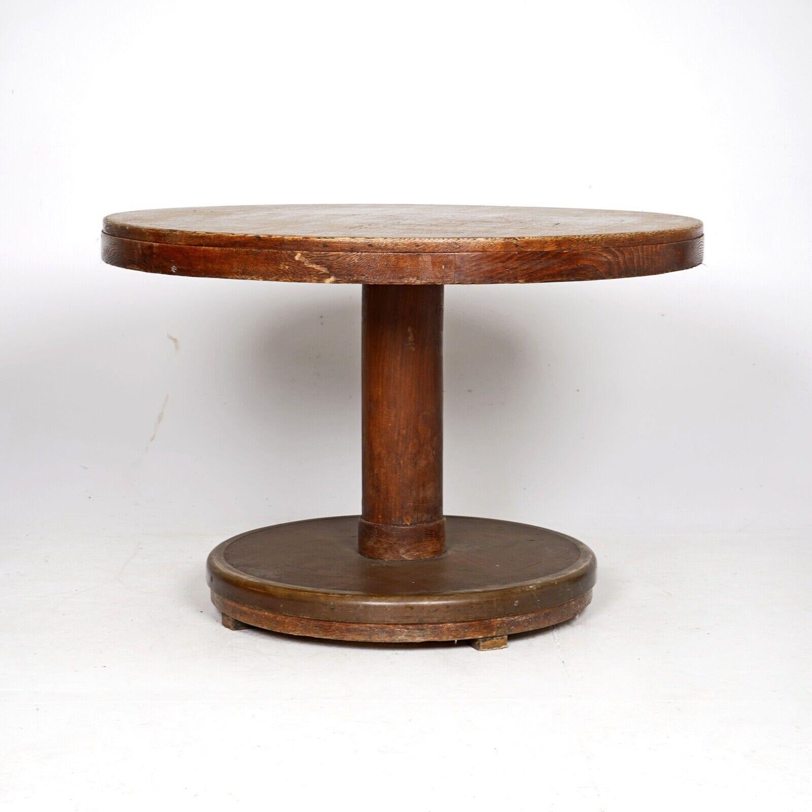  A beautifully simple pedestal dining table I was told came off a Cunard line ship.
Oak pedestal table, the base has a bronze trim around leather. 
The quality shows throughout the table, solid and very well made.

Condition 
Please do take a