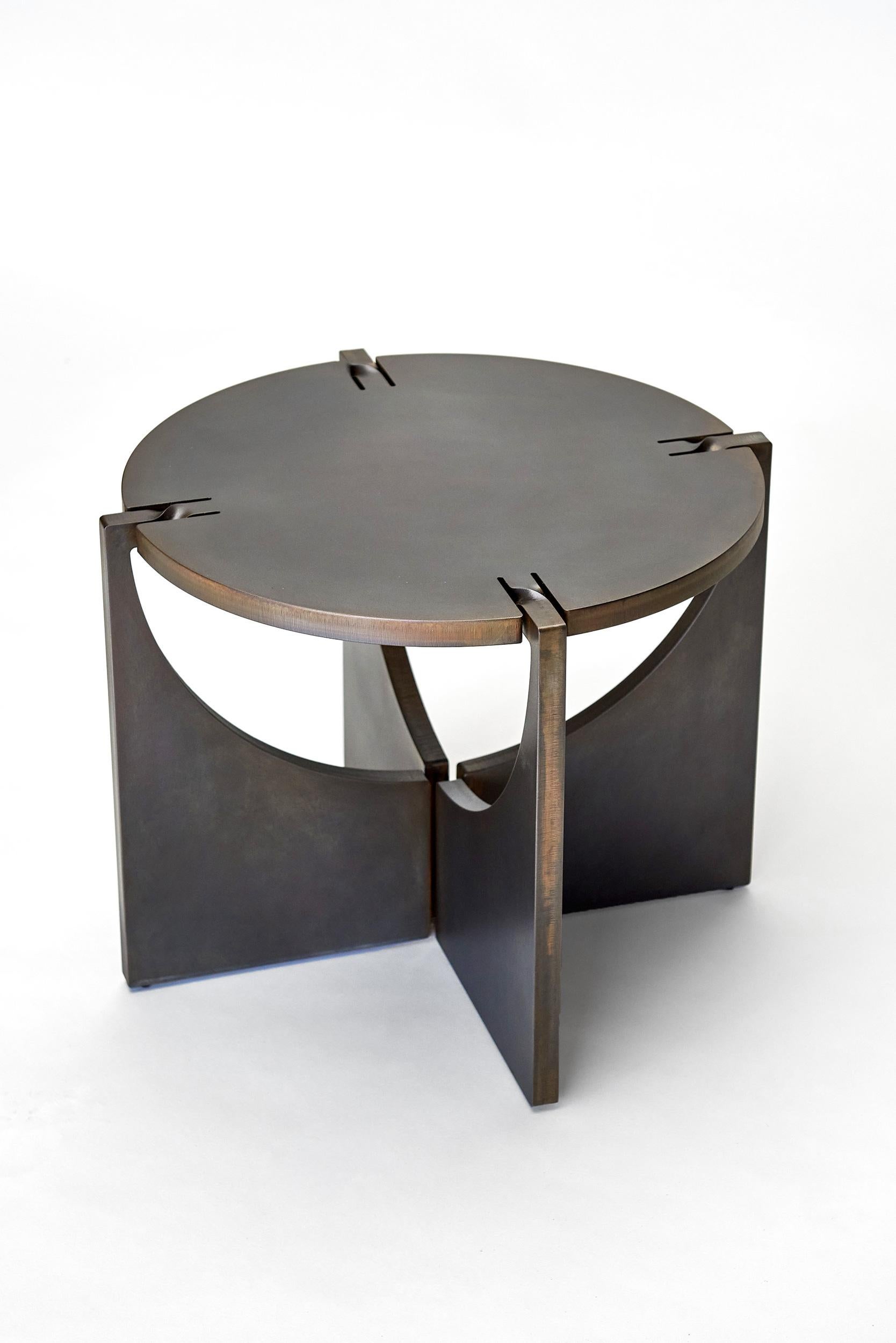 Round - ONE is part of the ONE series

ONE is a single sheet of metal. From its flat shape as a sheet it is forged and bended into the third dimension. This movement is visible in its shape. It shows the strength of the steel and combines old