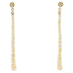 Orecchini a goccia con opale tondo in oro 14K e diamanti