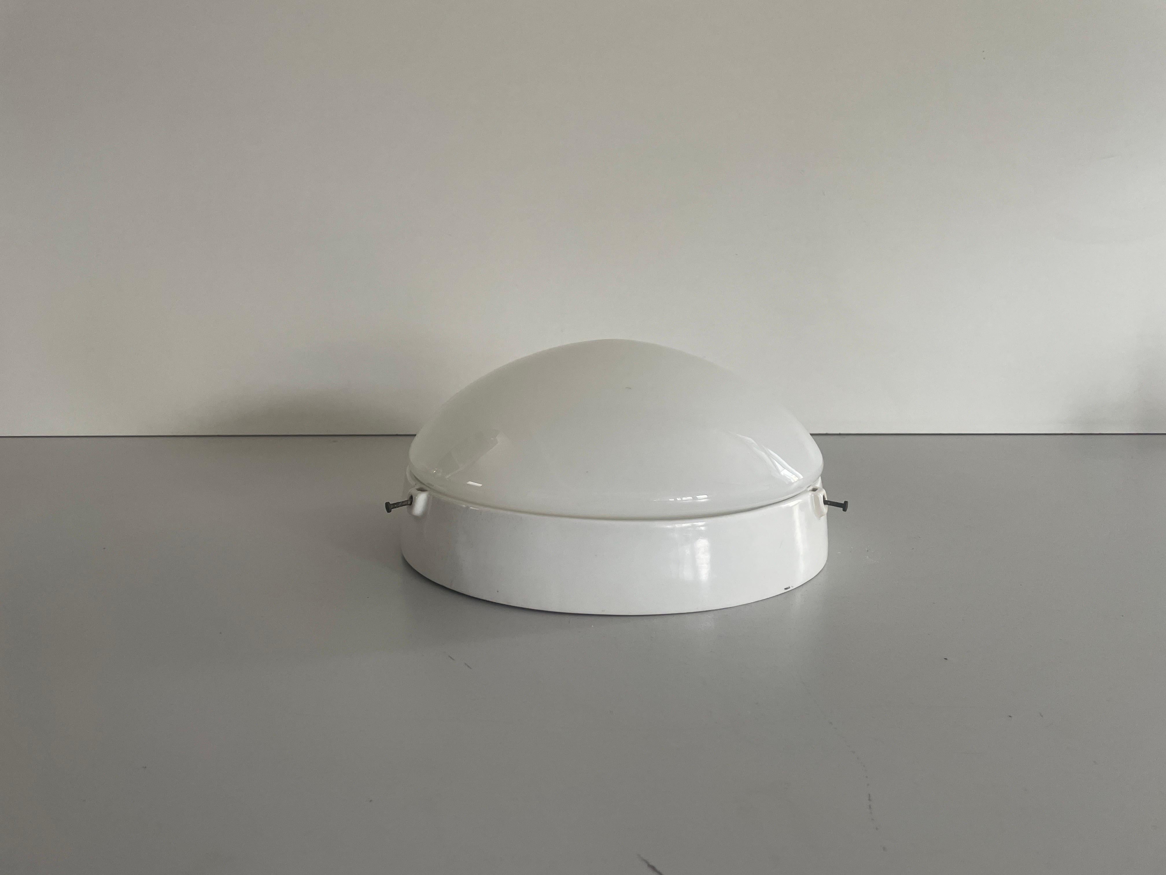 Round Opaline Glass and White Porcelain Single Bathroom Flush Mount Light, 1950s, Italy

Lampshade is in very good vintage condition.

This lamp works with 2x E27 light bulbs. 
Wired and suitable to use with 220V and 110V for all
