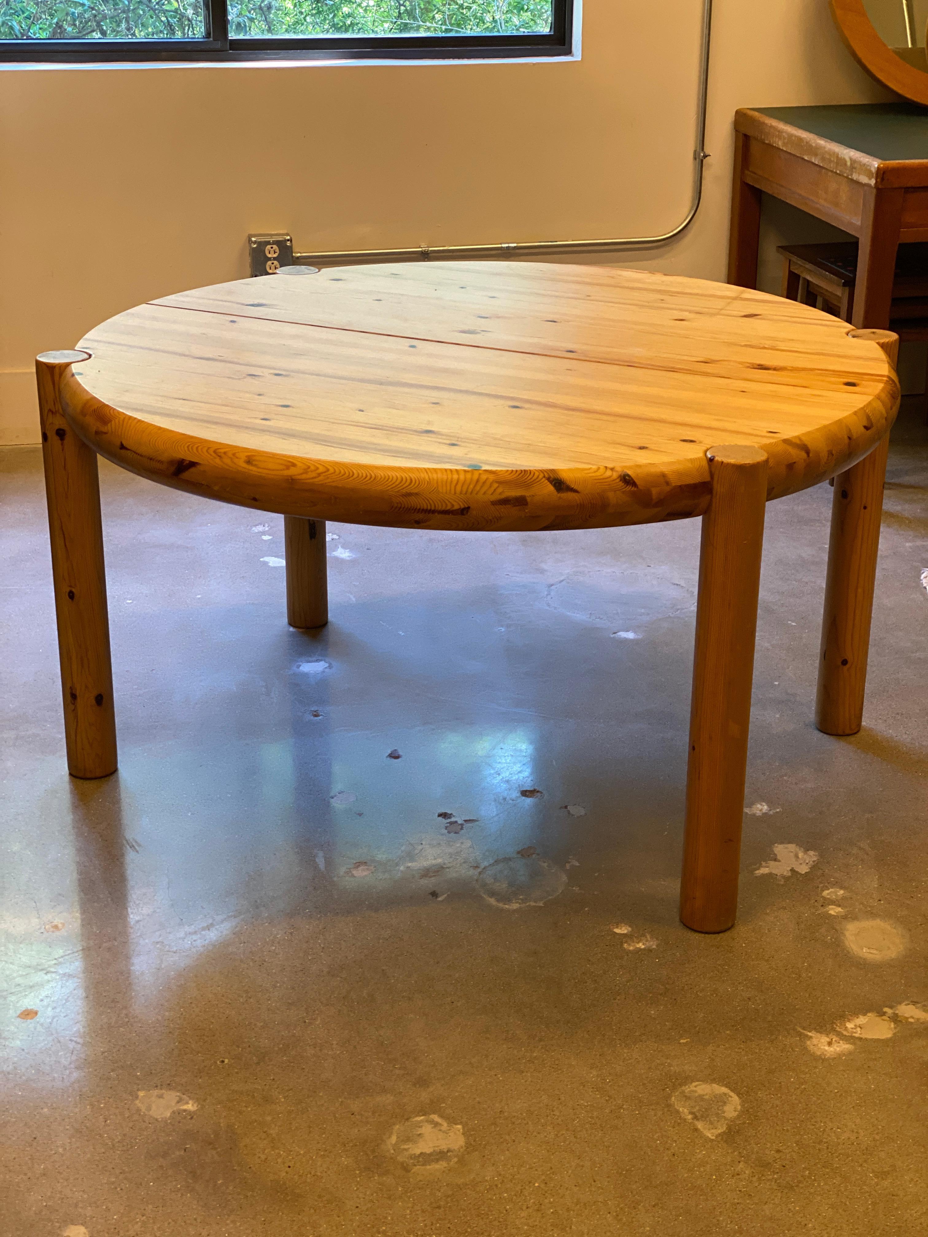 Mid-Century Modern or Scandinavian Modern dining table designed by Rainer Daumiller, Danish architect and designer. Round with four legs and extendable to oval with 23