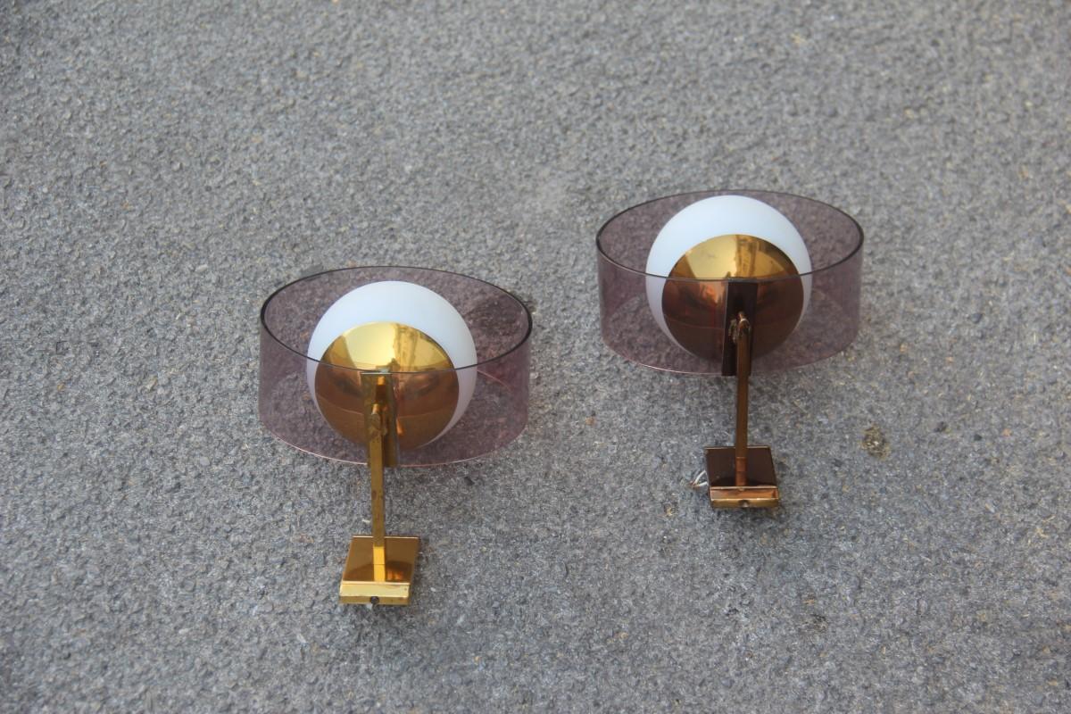 Round pair of Stilux wall sconces Plexiglass brass glass Mid-Century Modern.
One light bulb each E14 max 40 Watt.