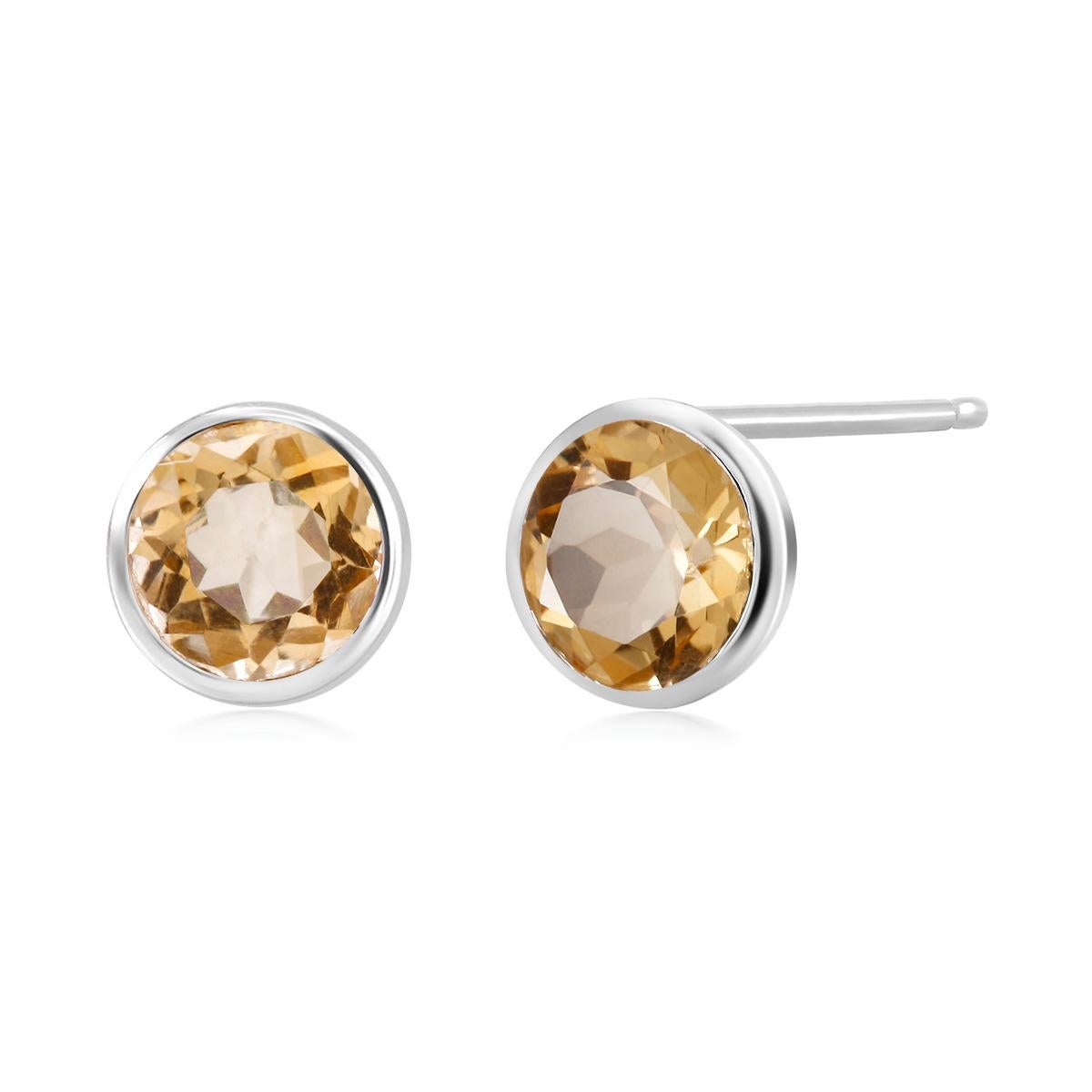 Sterling silver stud earrings
Two perfectly matched round yellow citrine weighing  6.00 carats
Earrings measuring  0.30 inch
Round blue topaz measuring 7 millimeter
New earrings
Handmade in the USA
