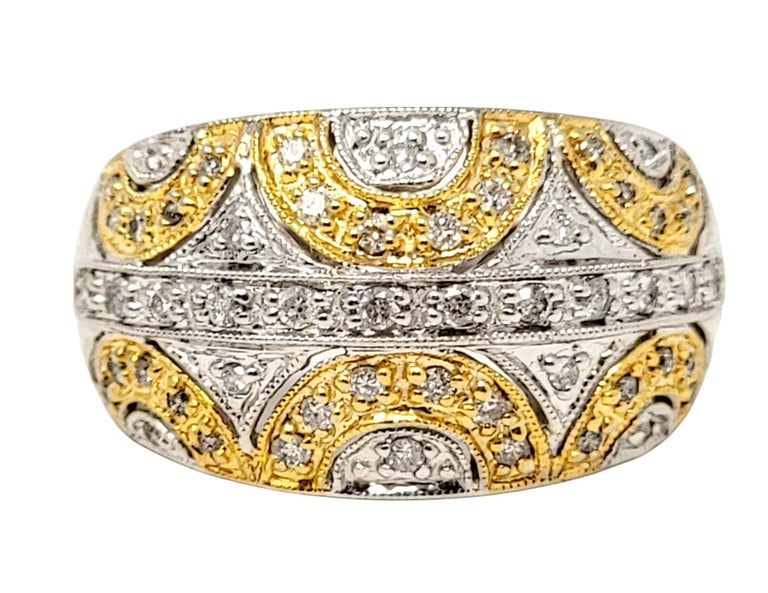 Ring size: 9

Sparkling two-toned gold and diamond dome ring with intricate milgrain detailing. 

Ring size: 9
Weight: 7.8 grams
Diamonds: .46 ctw
Diamond cut: Round Brilliant
Diamond color: I-J
Diamond clarity: I2
Stamped: 14K
Dome width: 14.36