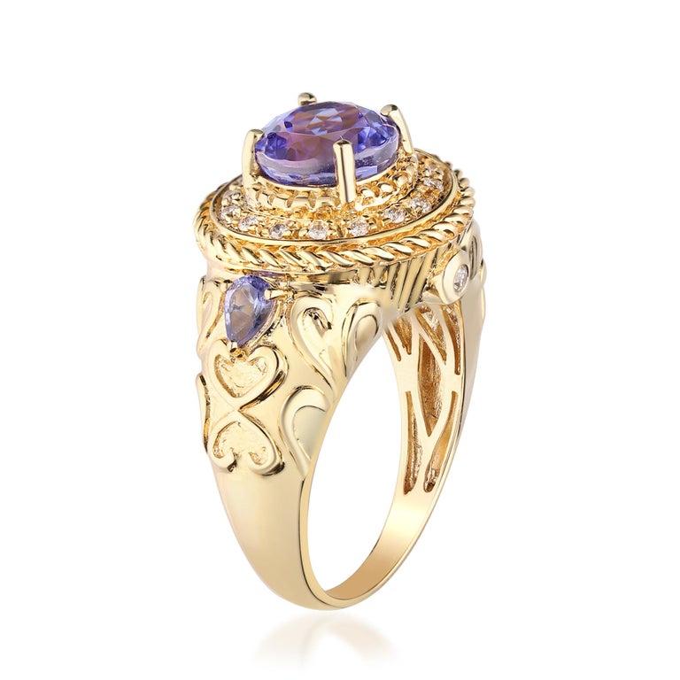 Art Deco Round, Pear-cut Tanzanite With Diamond accents 14K Yellow Gold Ring. For Sale