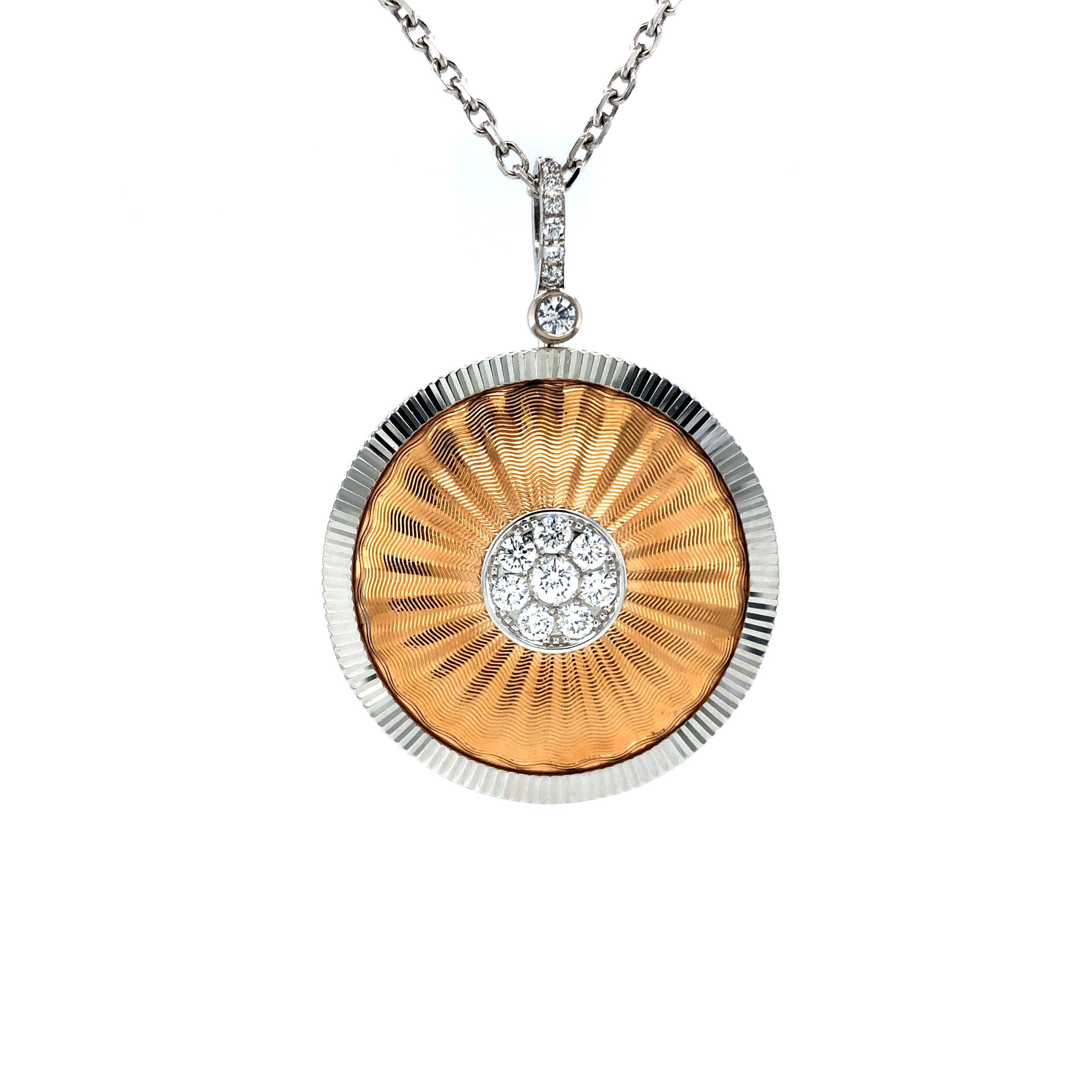 Victor Mayer round pendant, Opera collection, 18k white gold rose gold, guilloche engraving by hand, 18 diamonds, total 0.58 ct, G VS, diameter 30 mm

About the creator Victor Mayer
Victor Mayer is internationally renowned for elegant timeless