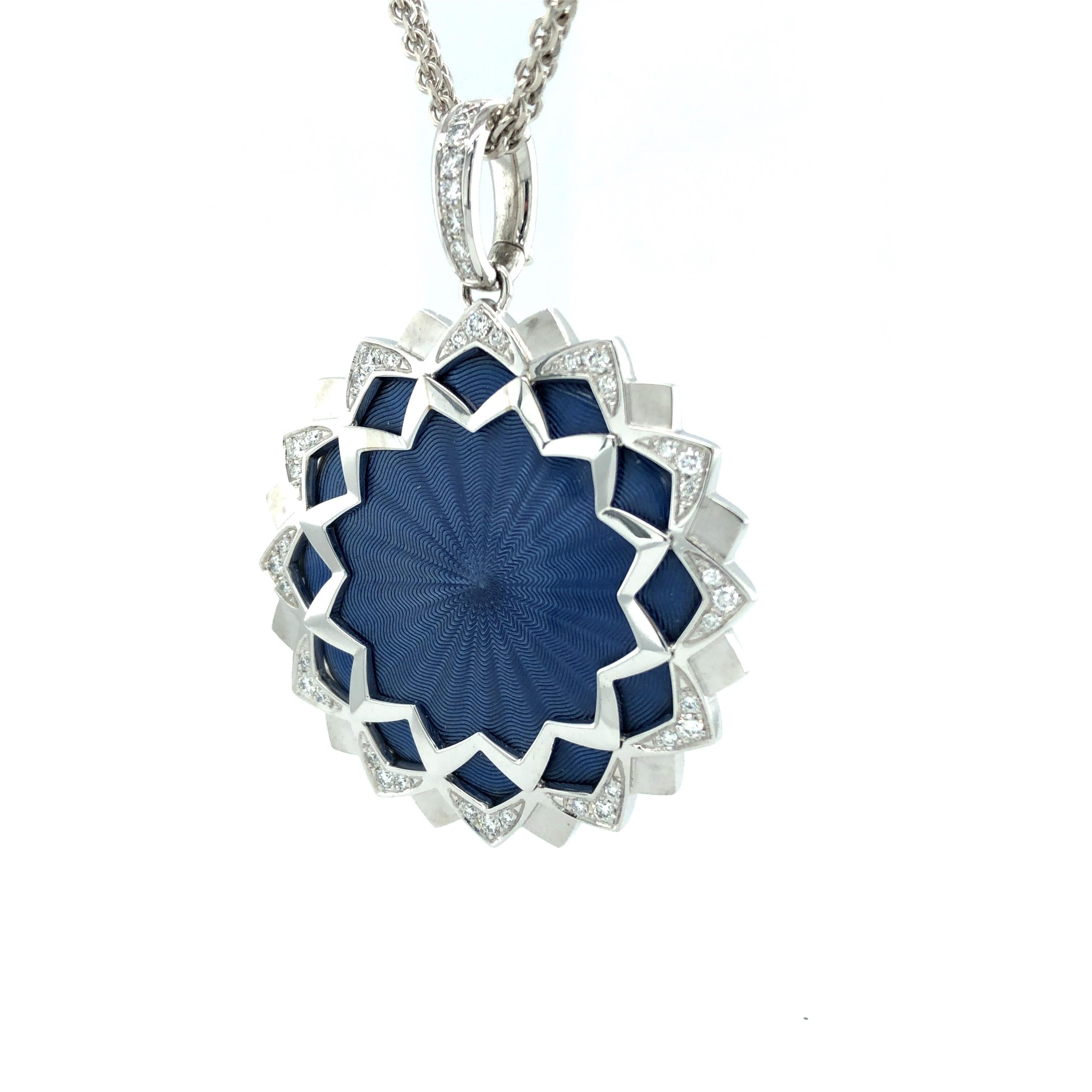 Victor Mayer round pendant in 18k white gold, Chrysanthemum Collection, translucent indigo blue vitreous enamel over guilloché engraving, set with 43 brilliant cut diamonds totalling 0.52 carats, colour G, clarity VS.

Reference: