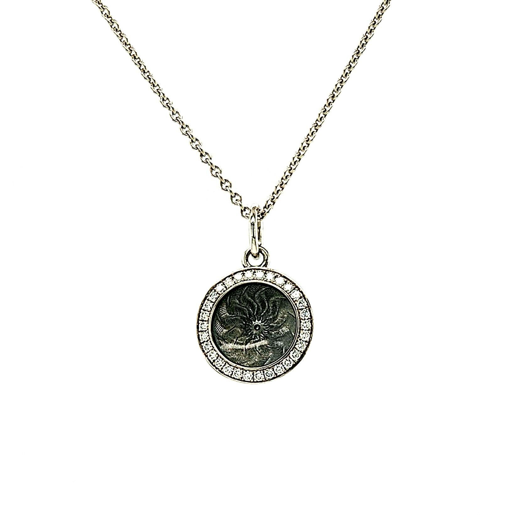 Victor Mayer round pendant necklace 18k white gold, Trance Collection, translucent light grey vitreous enamel, guilloche, 30 diamonds, total 0.15 ct, G VS, diameter app. 12.5 mm

About the creator Victor Mayer
Victor Mayer is internationally