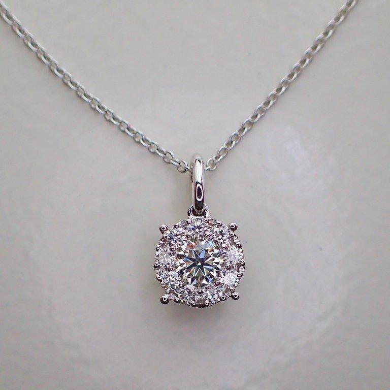 Round Cut Round Pendant with 0.46 Carat of Diamond Hangs from an 18 Karat White Gold Chain For Sale