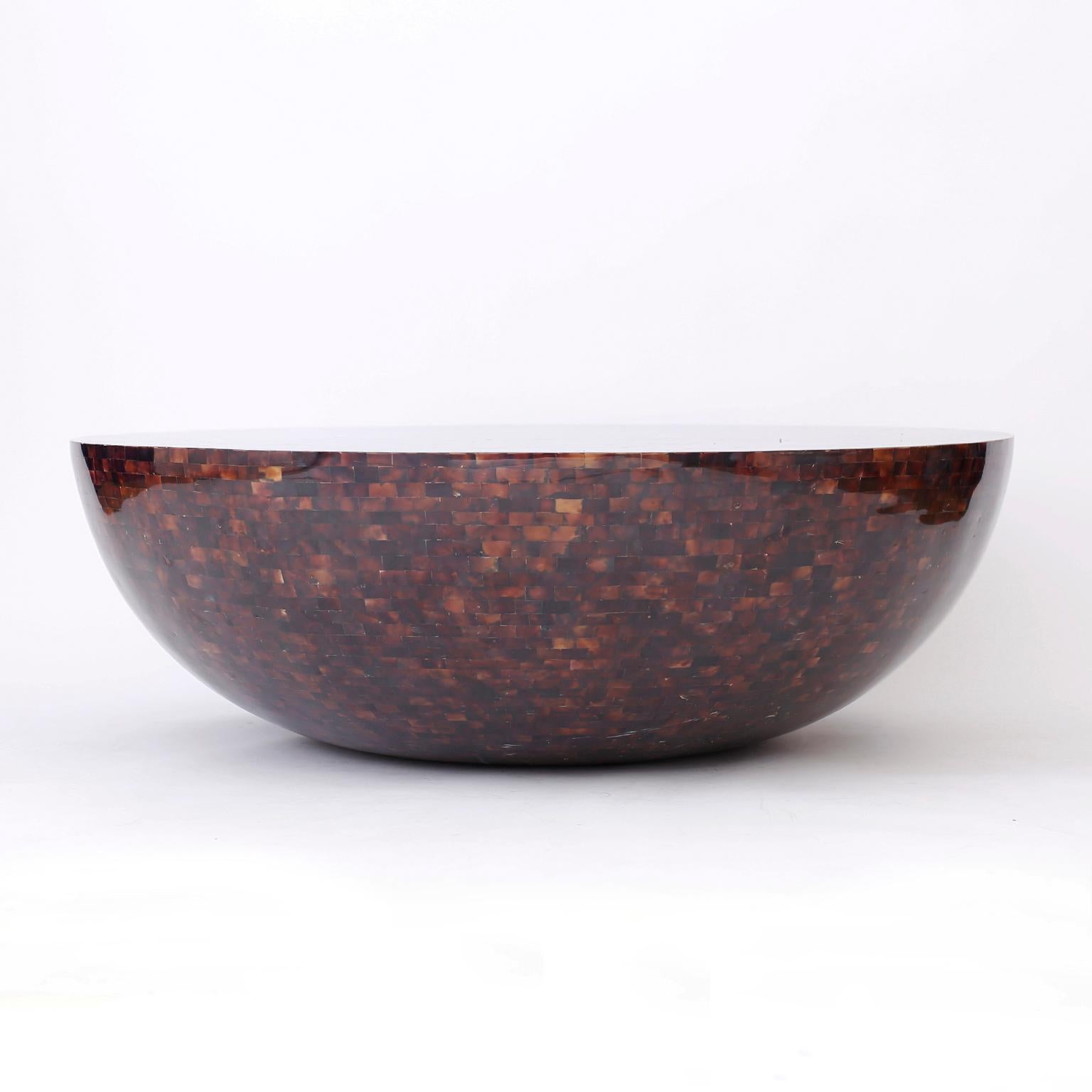 Coffee table with a round bowl form entirely clad in a dark lush penshell mosaic.