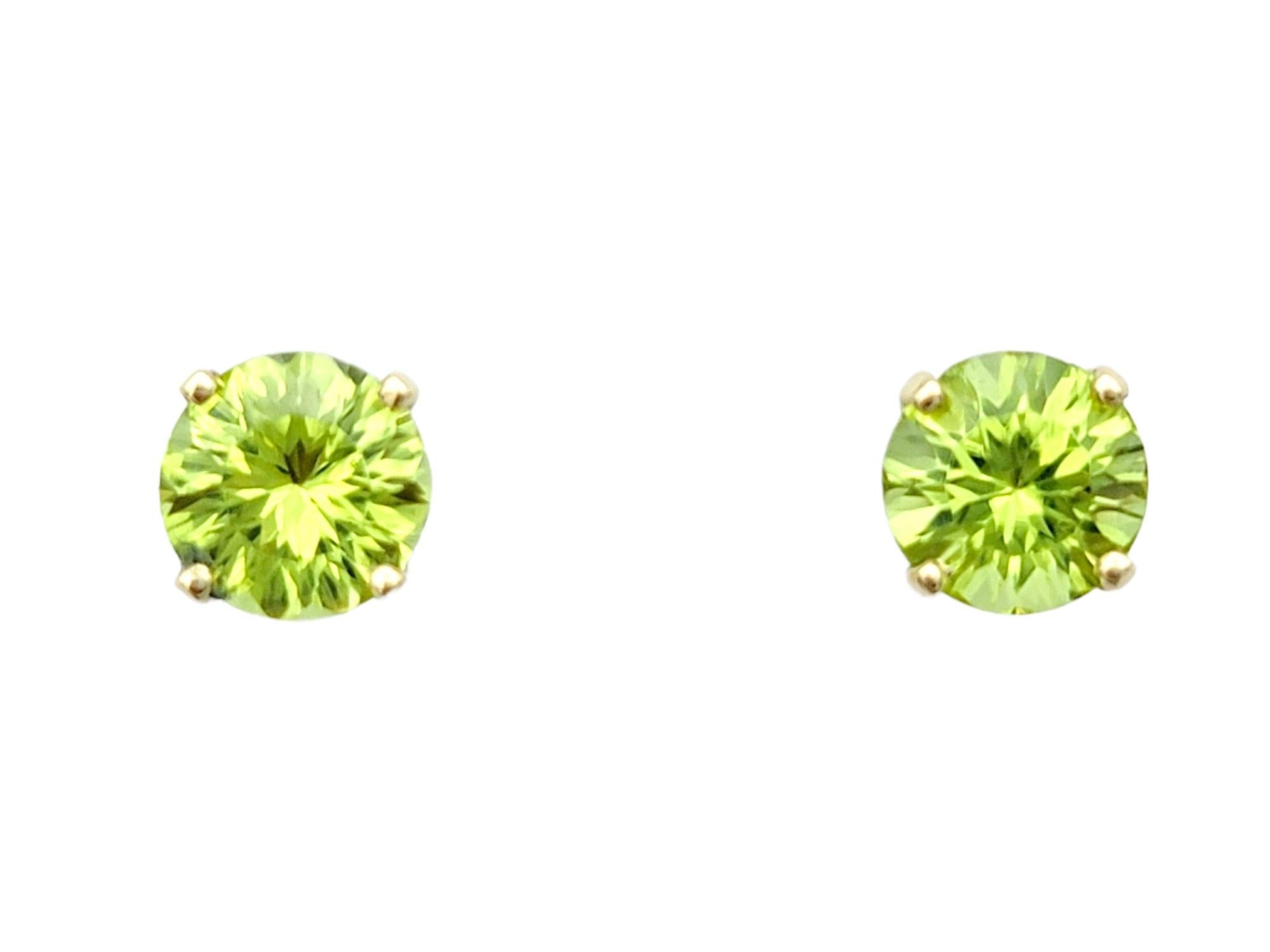 Round Cut Round Peridot Stud Earrings with Diamond Halo Jackets in 14 Karat Yellow Gold For Sale