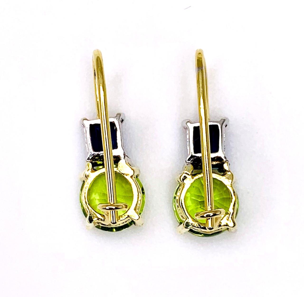 These earrings are a fresh, new look in fine jewelry! The creative use of colors and shapes is clear in the design of these beautiful drop earrings as vibrant, 