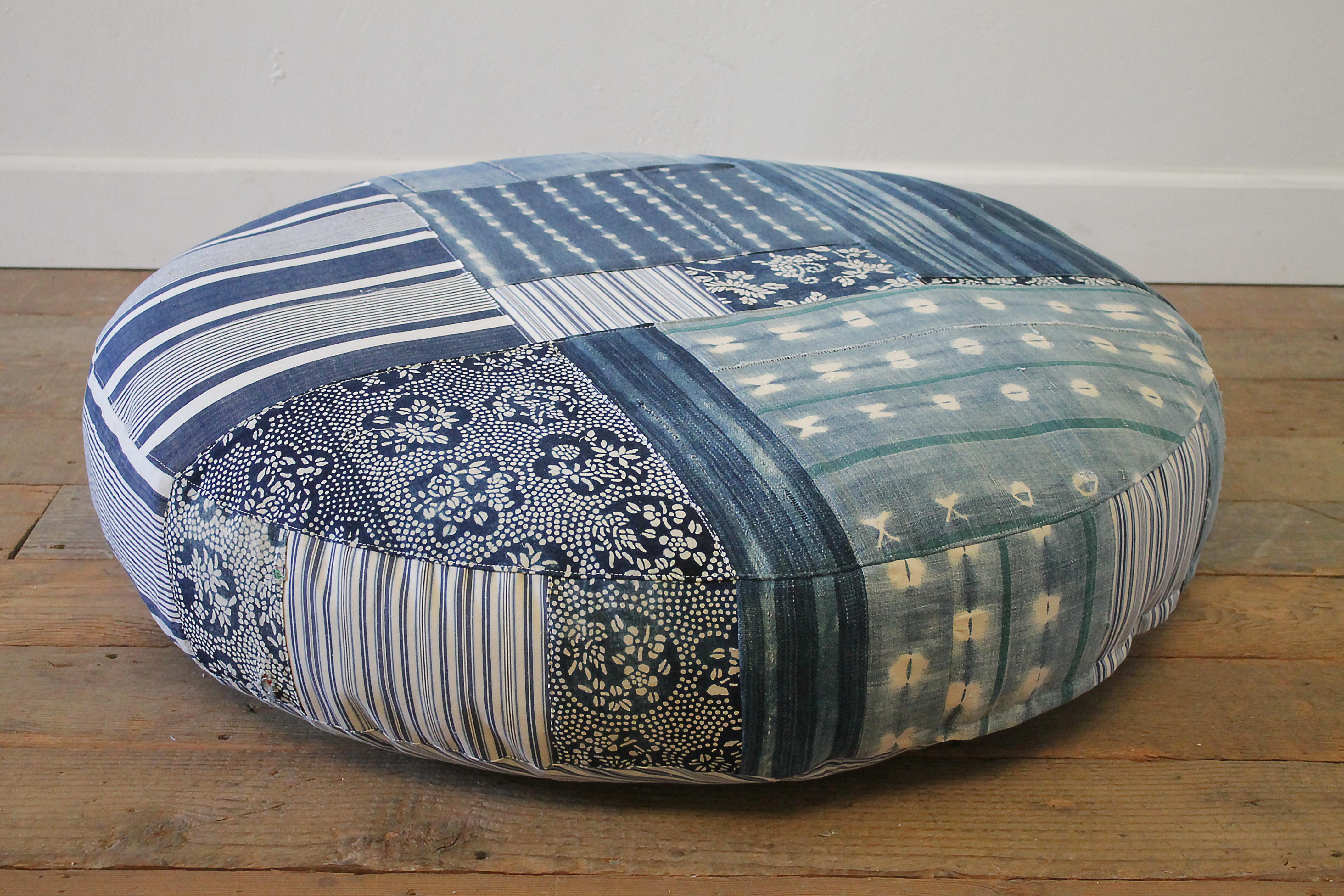 Round pet bed made from vintage batik mud cloth Indigo textiles. Custom made in our full bloom cottage studio, from vintage and antique textiles. A French mattress ticking stripe, antique Japanese batik, and African mud cloths make up this ultra