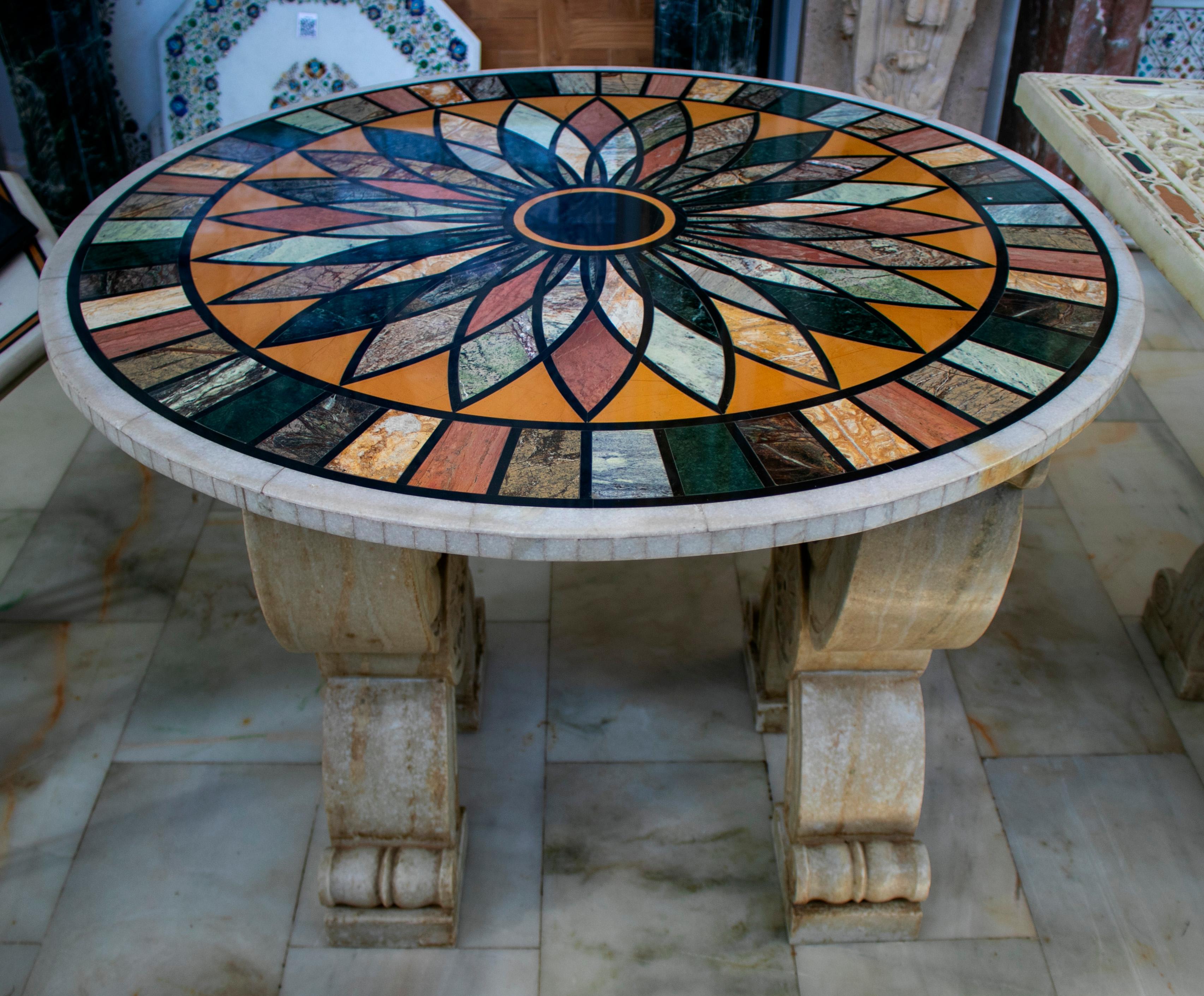 Round Italian geometric pietre dure technique handmade mosaic table top with different marble and semiprecious stones.
 