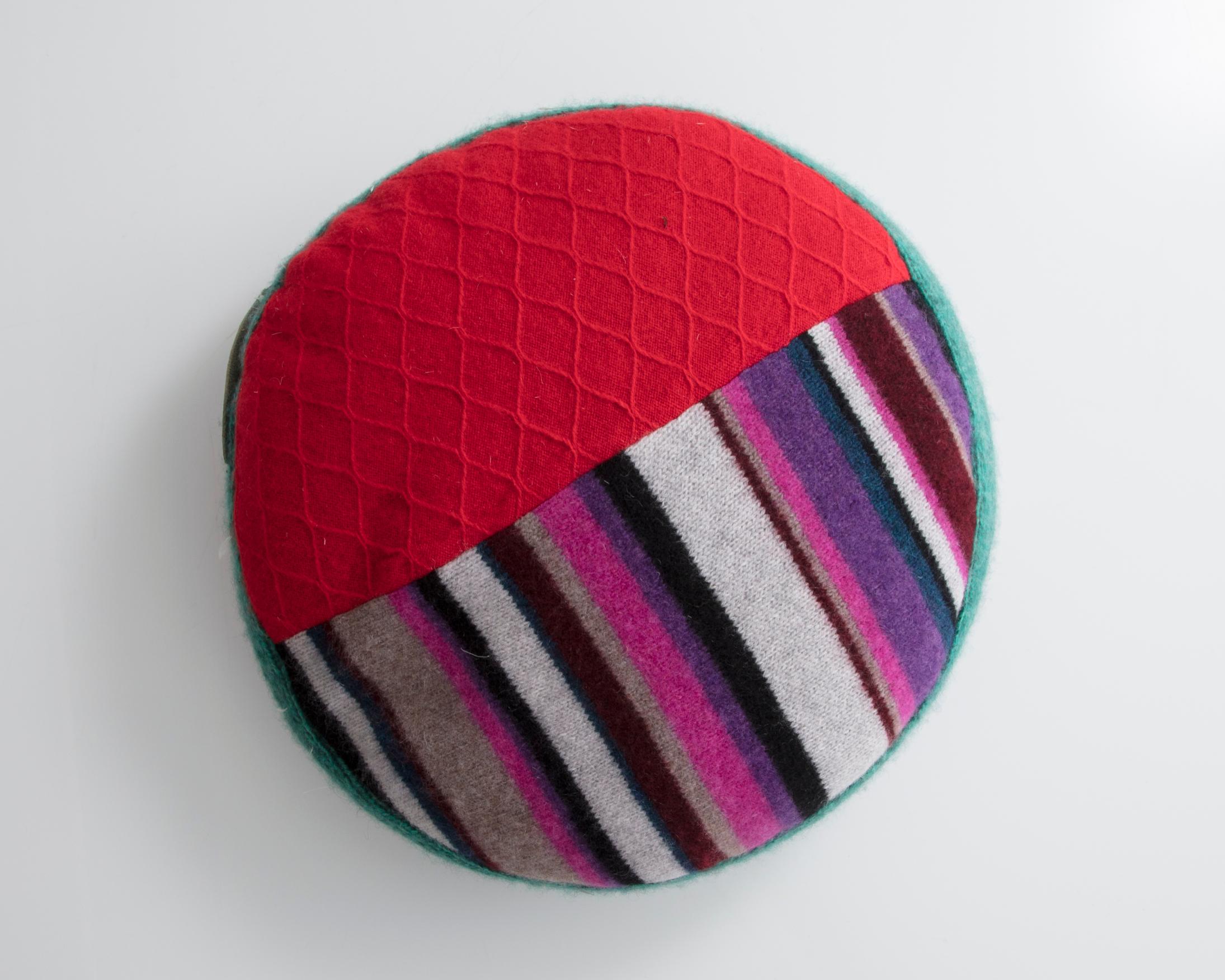 Unique round pillow in multi-colored cashmere. Designed and made by Greg Chait, USA, 2016.