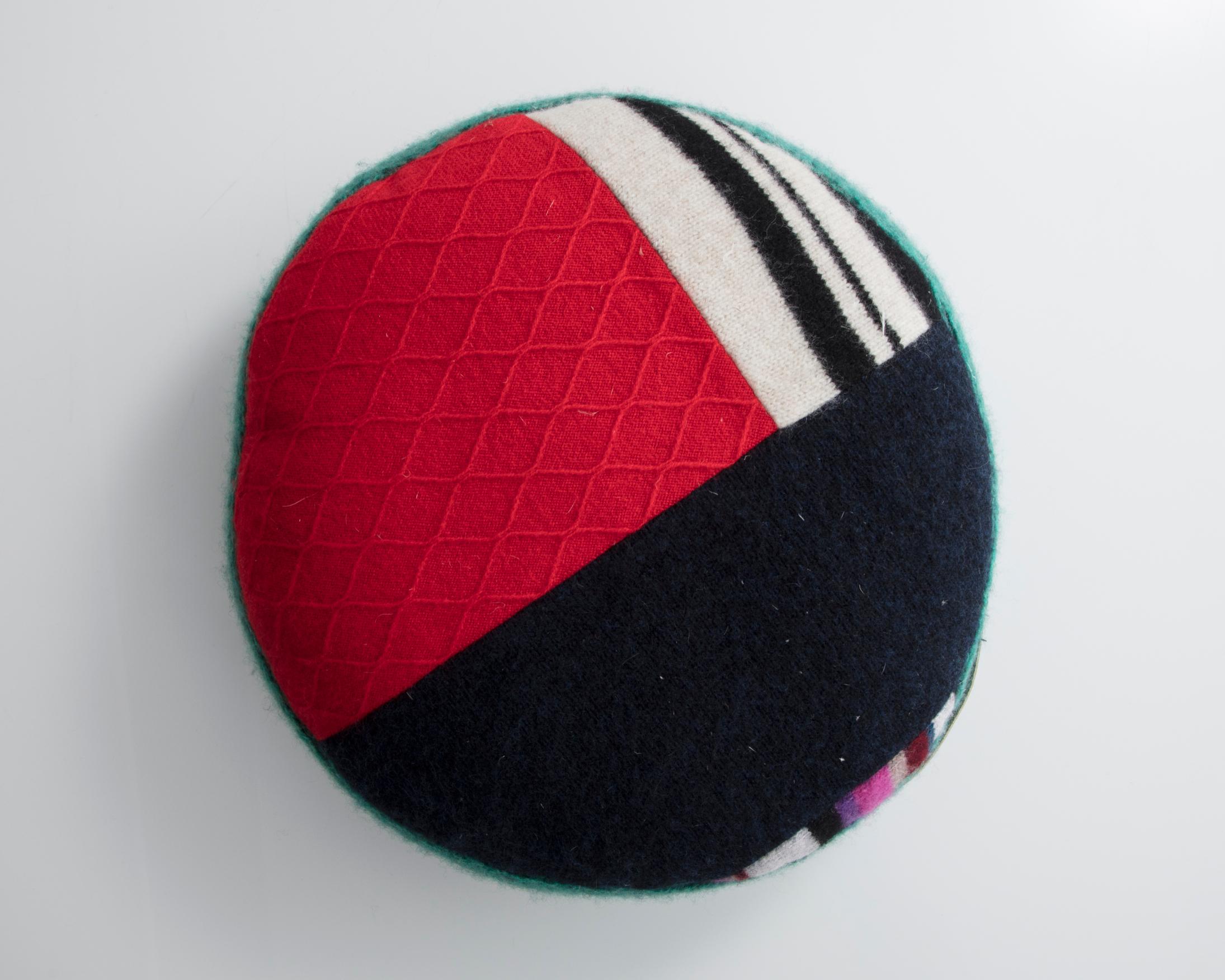 Unique round pillow in multi-colored cashmere. Designed and made by Greg Chait, USA, 2016.