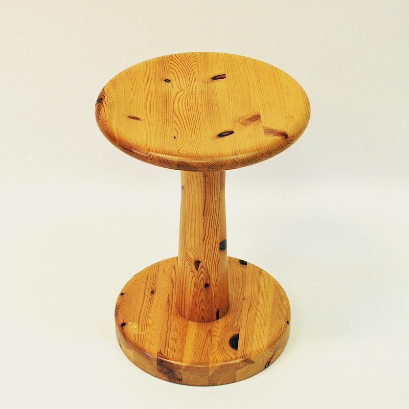 Practical and attractive pine stool attributed to Rainer Daumiller for Hirtshals, 1960s, Denmark. Perfect patina with a round sculpted seat and a solid base. Both to be used as a stool, table, flower stand and footrest. Original box