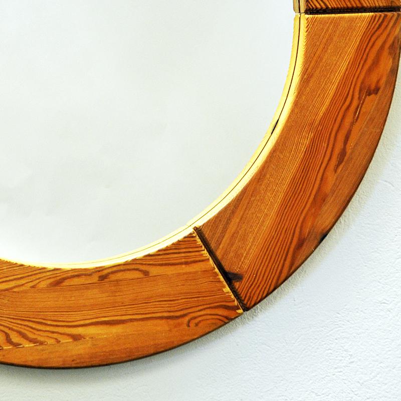 Round and big pine mirror diameter 100 cm by Glasmäster Markaryd, Sweden in the 1950s. Massive pine frame which are sectioned in six parts around the mirror. Big, rough and solid mirror suitable for every room and space including your cabin. Other