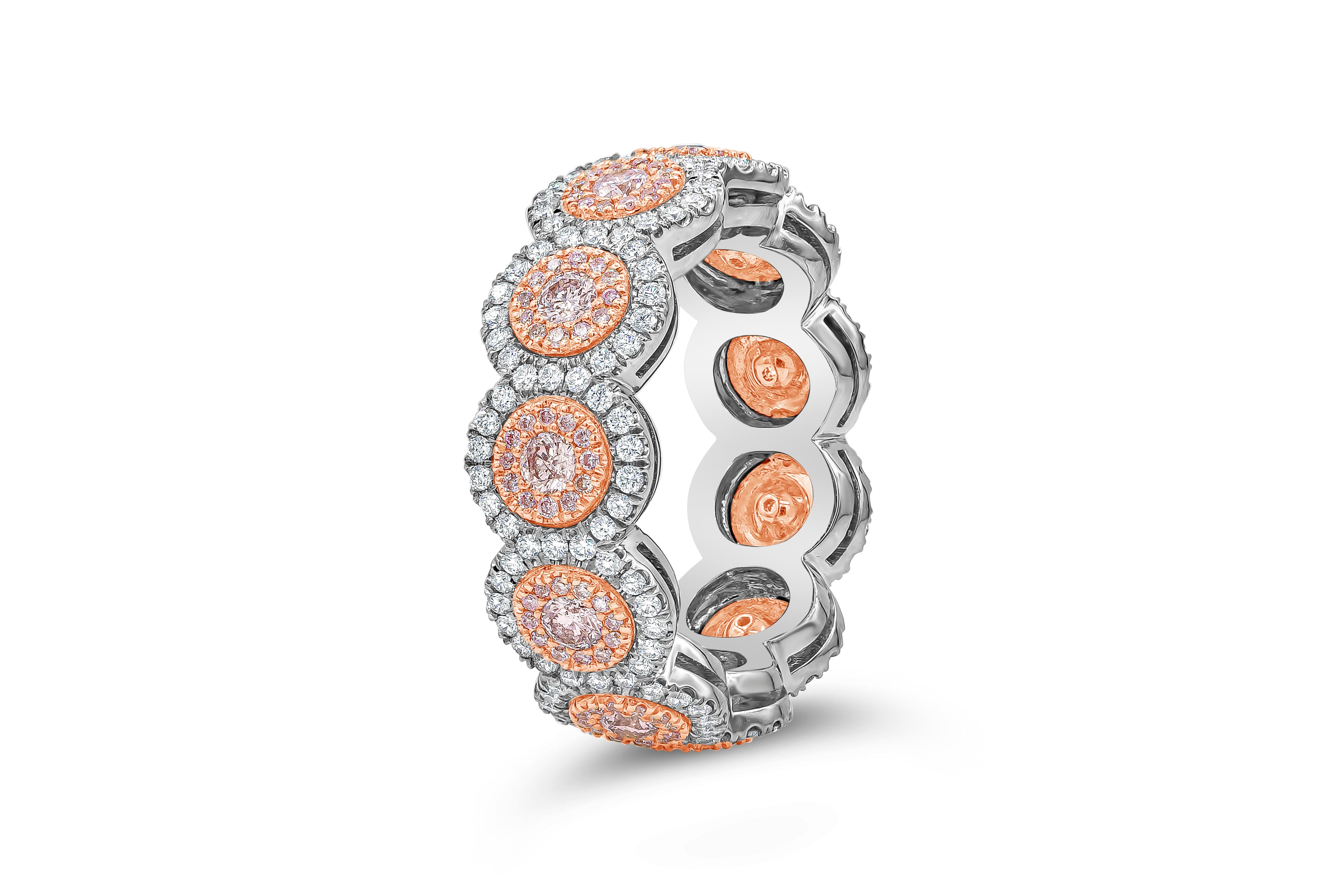 A unique eternity ring featuring 11 round pink diamonds, elegantly set in a double halo design encrusted with pink and white diamonds. Pink diamonds weigh 0.86 carats total, set in 18K Rose Gold, White diamonds weigh 0.63 carats total. Made with