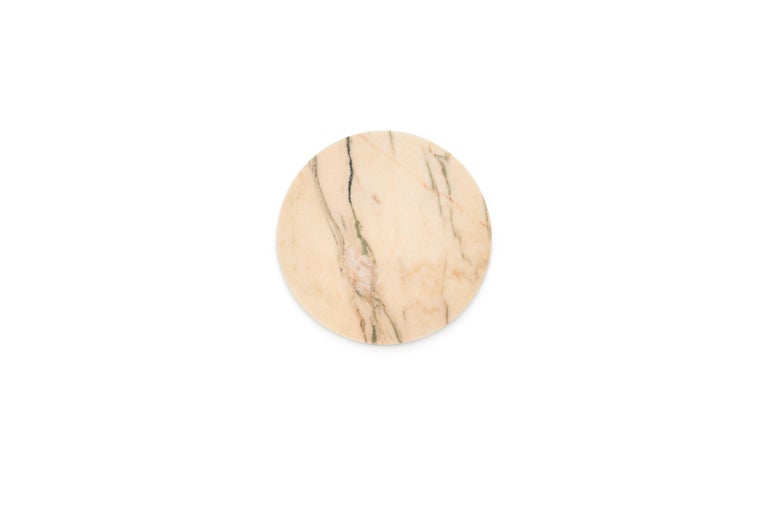Rounded pink Portugal marble cheese plate. Each piece is in a way unique (every marble block is different in veins and shades) and handmade by Italian artisans specialized over generations in processing marble. Slight variations in shape, color and