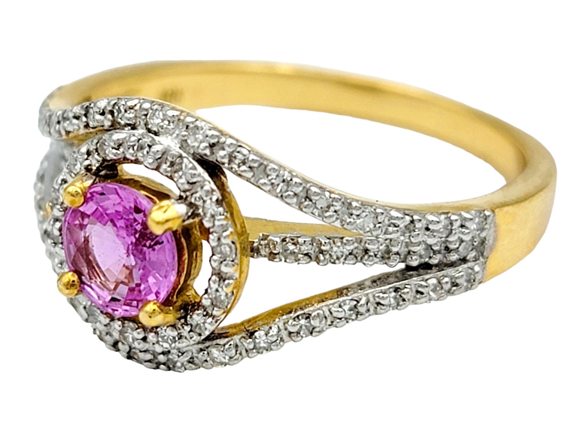 Contemporary Round Pink Sapphire and Diamond Halo Split Shank Ring in 18 Karat Yellow Gold For Sale
