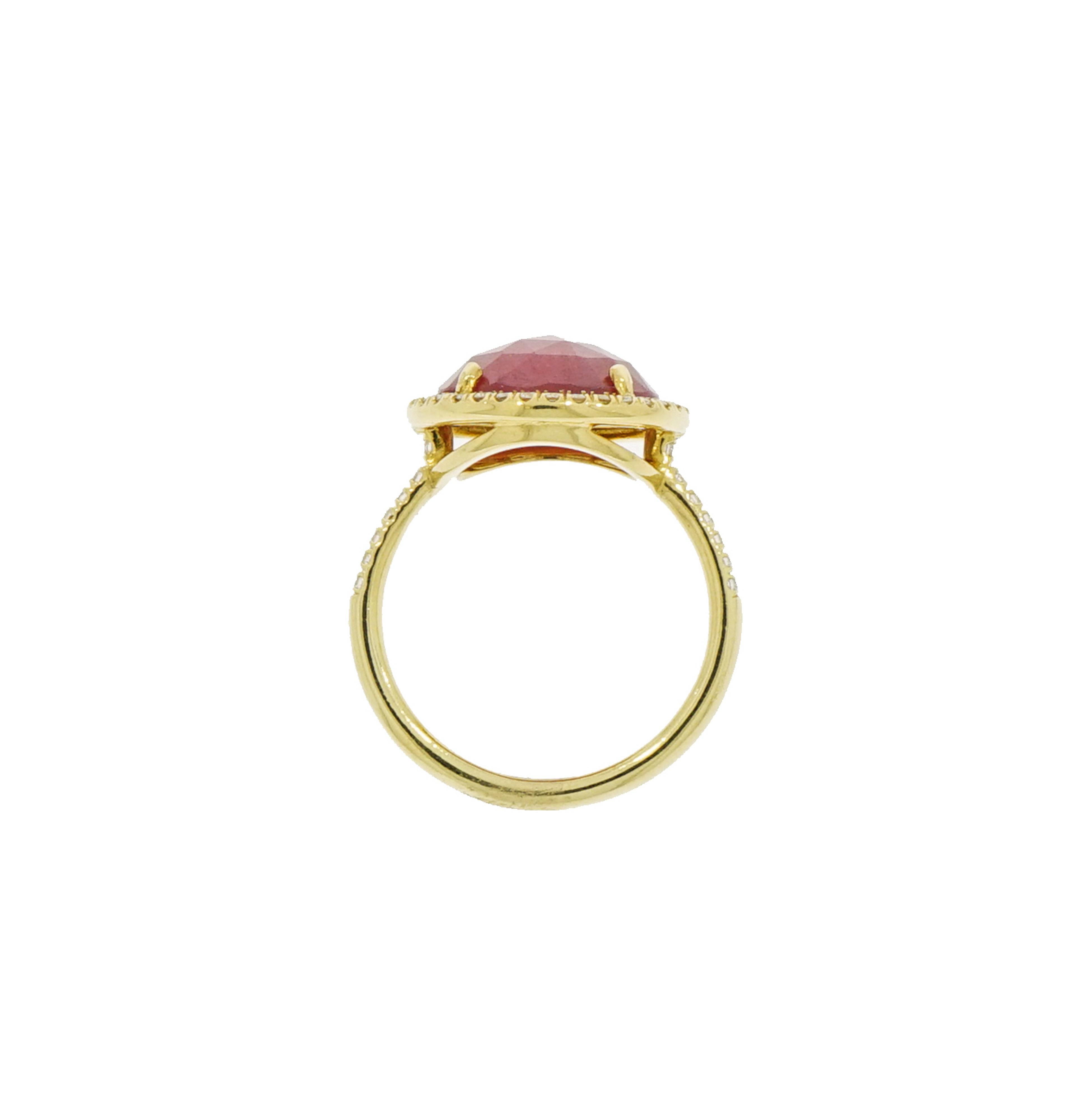 The simplicity of a geometric shape is key to the design of this Round Pink Sapphire and Diamond Ring.
Designed and crafted in NYC by Lauren K, this precious Opaque Pink Sapphire is embellished with a halo of white diamonds set in 18k yellow gold
