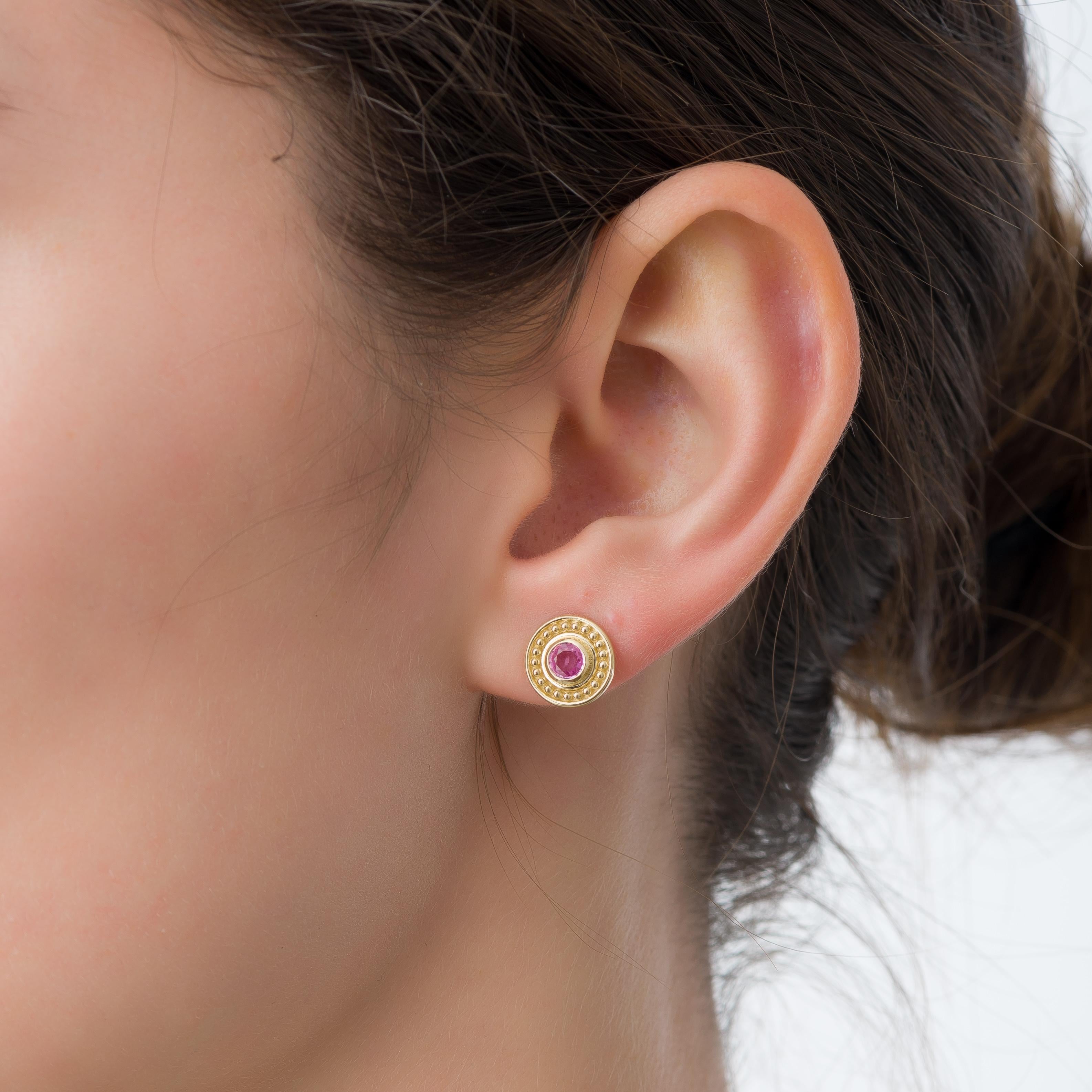Embrace the epitome of elegance with our gold earrings, each meticulously crafted to showcase a captivating round pink sapphire—a symbol of enduring allure and timeless sophistication. Elevate your style with this luxurious touch that enhances every