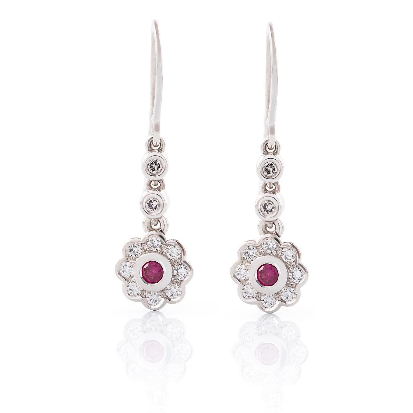 Cluster Diamante Earrings

The perfect complement to any lady. These gorgeous diamond cluster drop earrings are featured a pair of treated pink diamonds with the surrounding white diamonds, simple and elegant.

Round brilliant cut diamonds: Treated