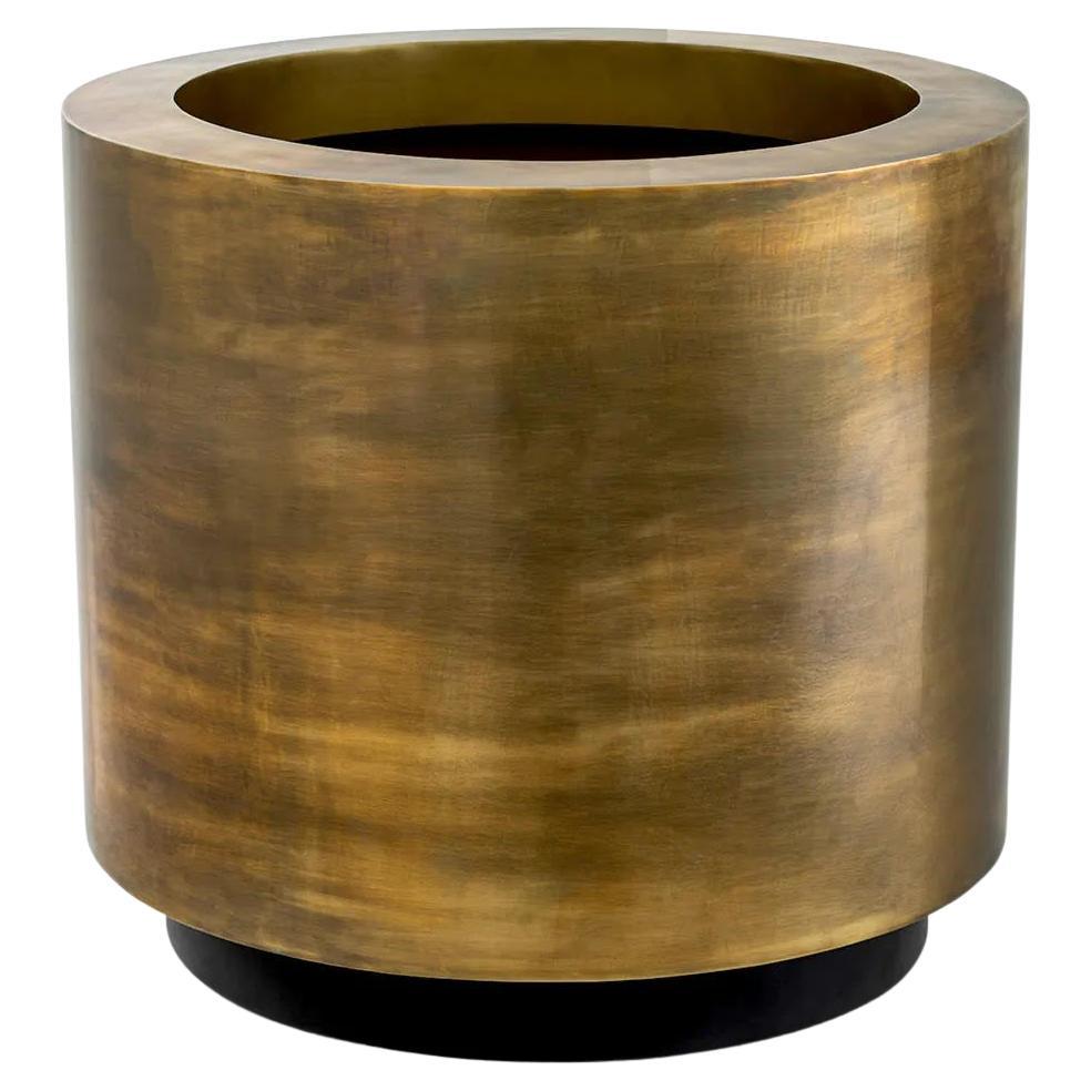 Round Planter, Patinated Brass Finish, Black Base, Functional Elegance.