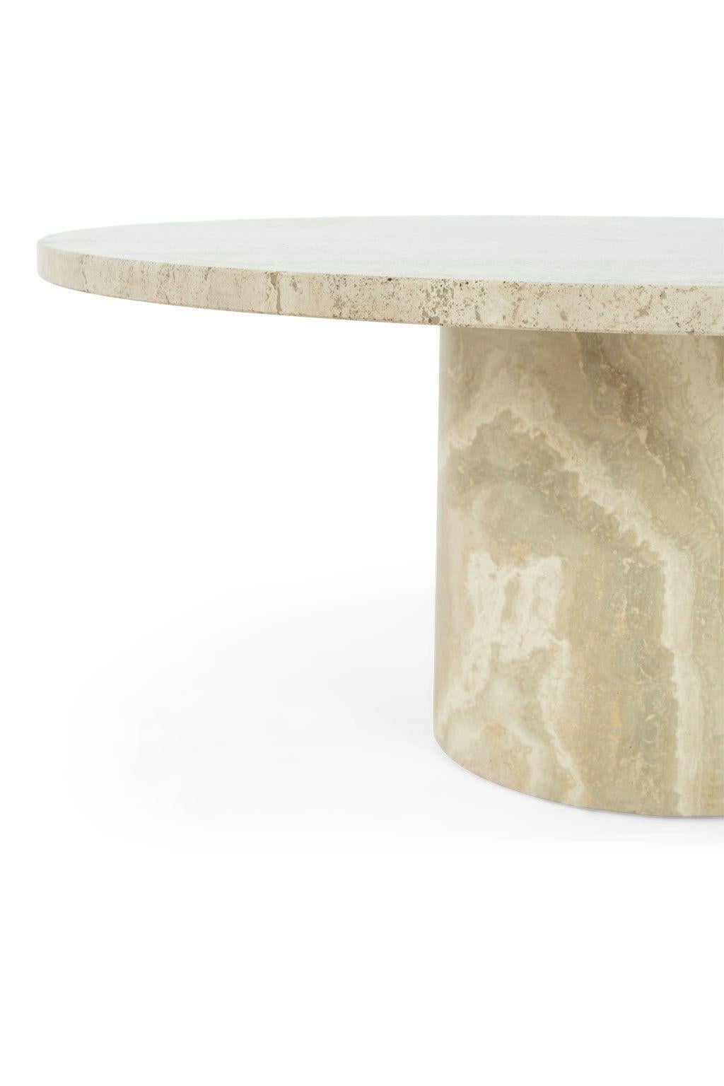 Round polished travertine coffee table circa 1980-1999.