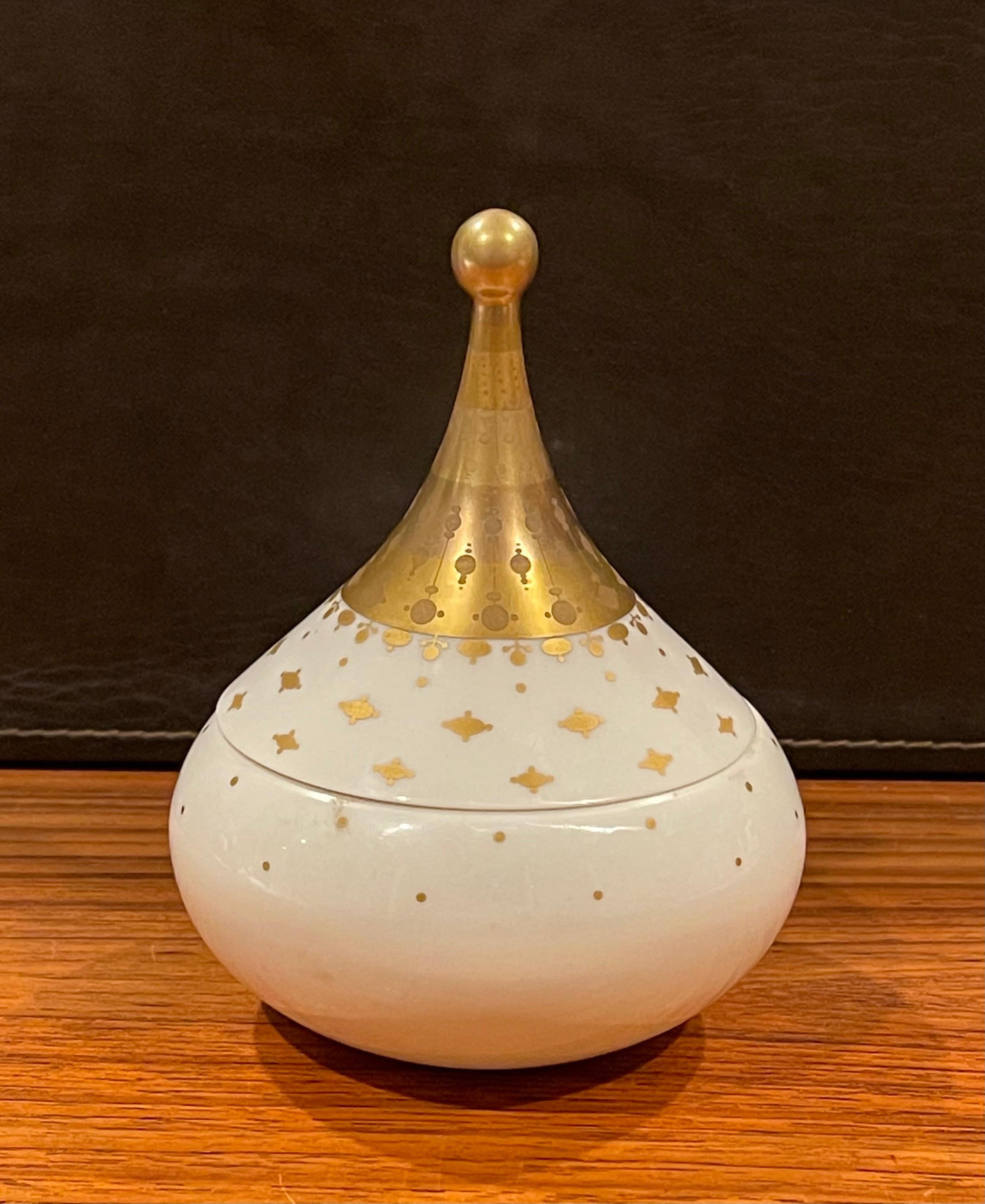 Round porcelain lidded trinket box by Bjorn Wiinblad for Rosenthal Studio Line, circa 1970s. The box is 5