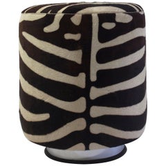 Round Pouf on Steel Metal Base with Faux Animal Skin and Self Welt at the Seat