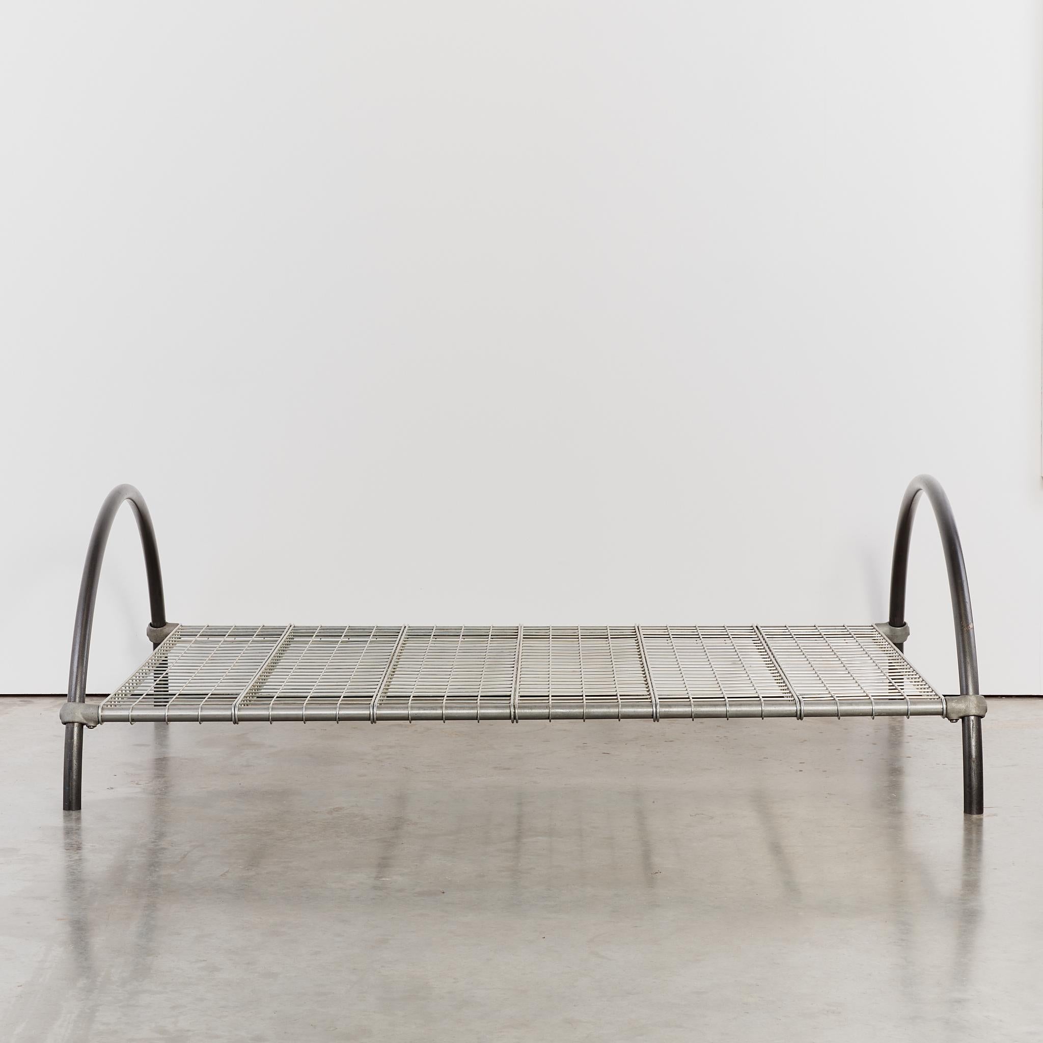 Round Rail bed by designer Ron Arad, with enamelled tubular steel, wire-mesh panels, kee-klamps and six strut horizontal supports.

Ron Arad, RDI is a British-Israeli industrial designer, artist, and architectural designer. Born in Tel Aviv in 1951,