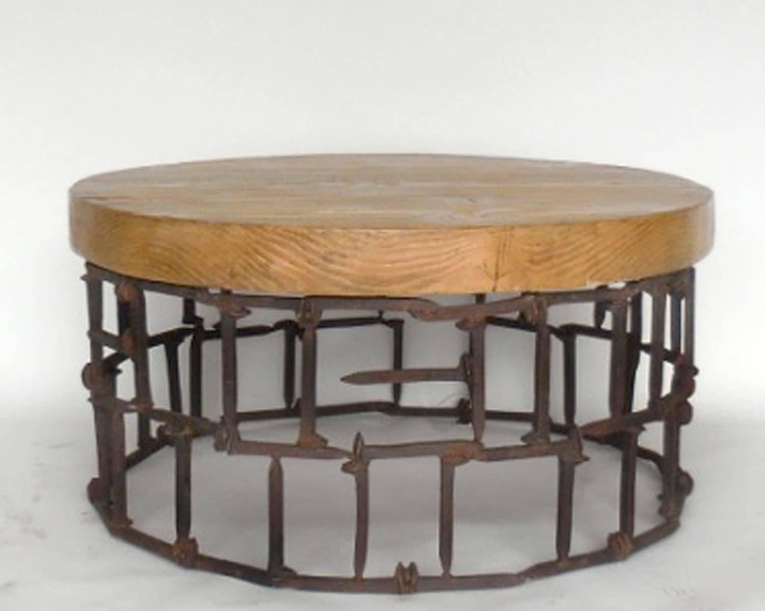 Antique rail road spikes fashioned into a circular base with a 3.5 inch thick reclaimed wood top in a light 