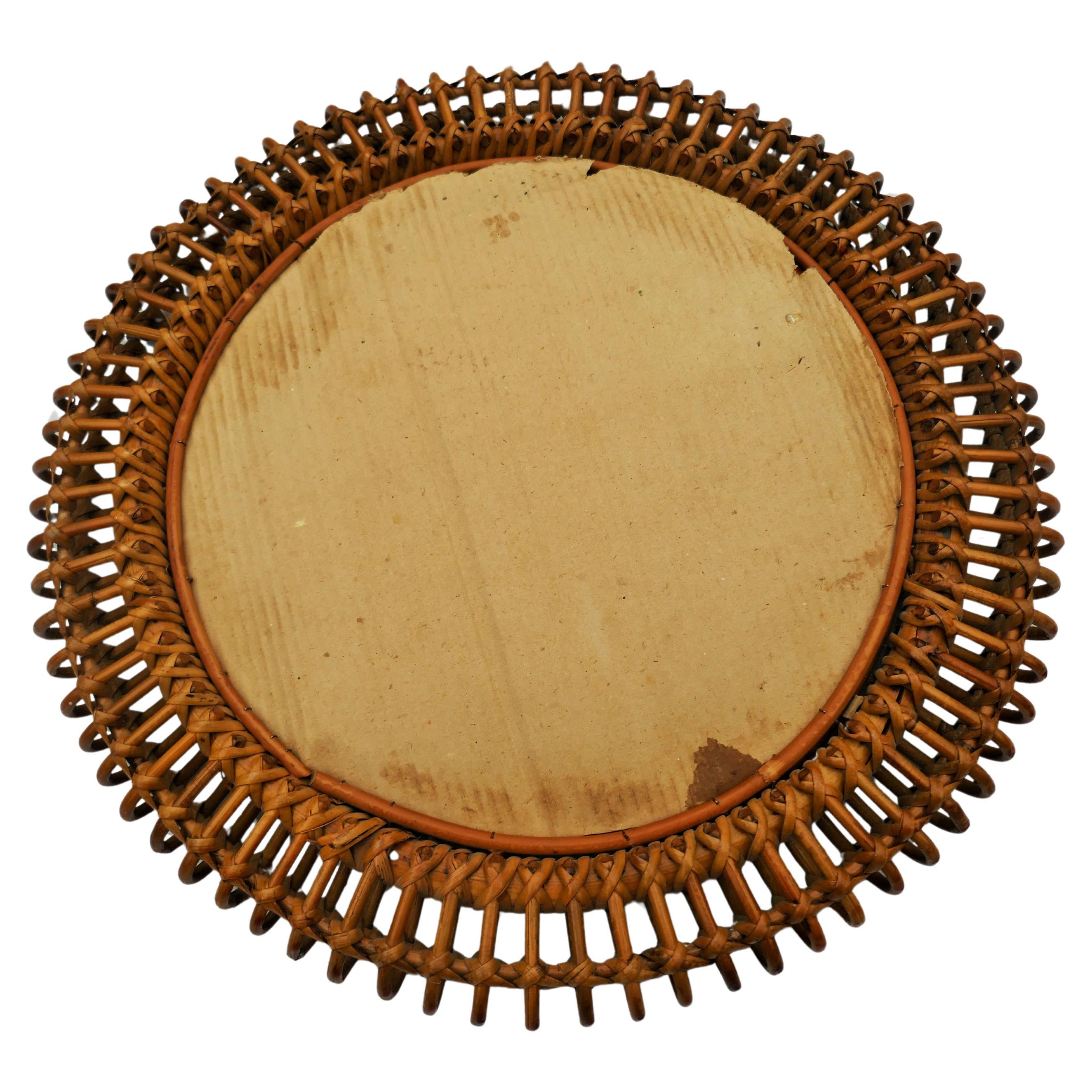 Round mirror in rattan and bamboo attributed to Bonacina.
Good condition.
Thanks