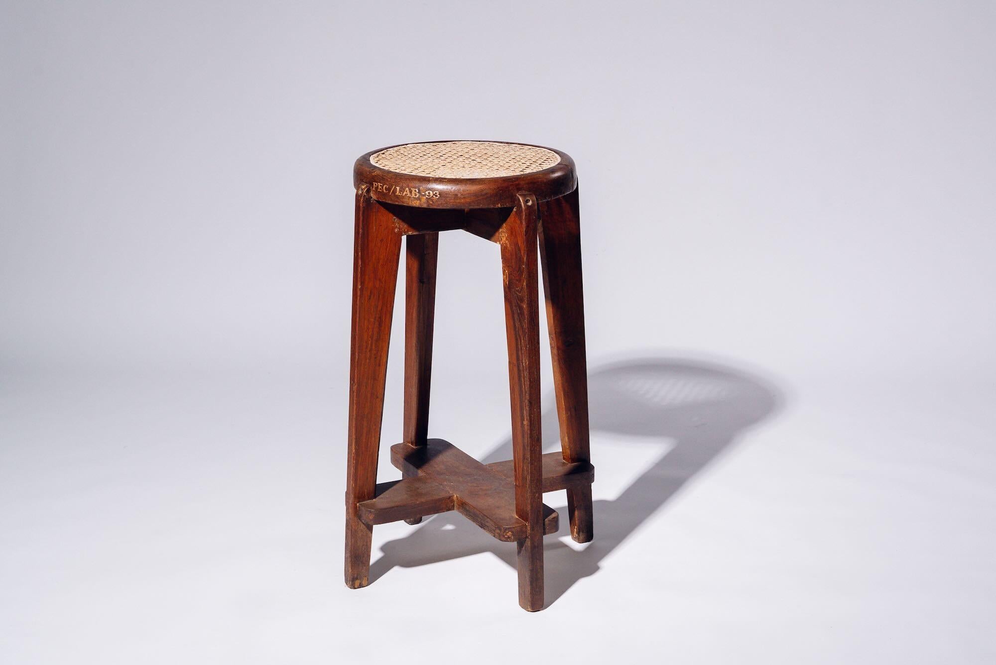 An authentic mid-century piece from Pierre Jeanneret’s legendary Chandigarh commission. Teak frame with hand-woven bamboo-rattan seat.

Letter : PEC/LAB-93 (Punjab Engineering College/LAB N° 93)