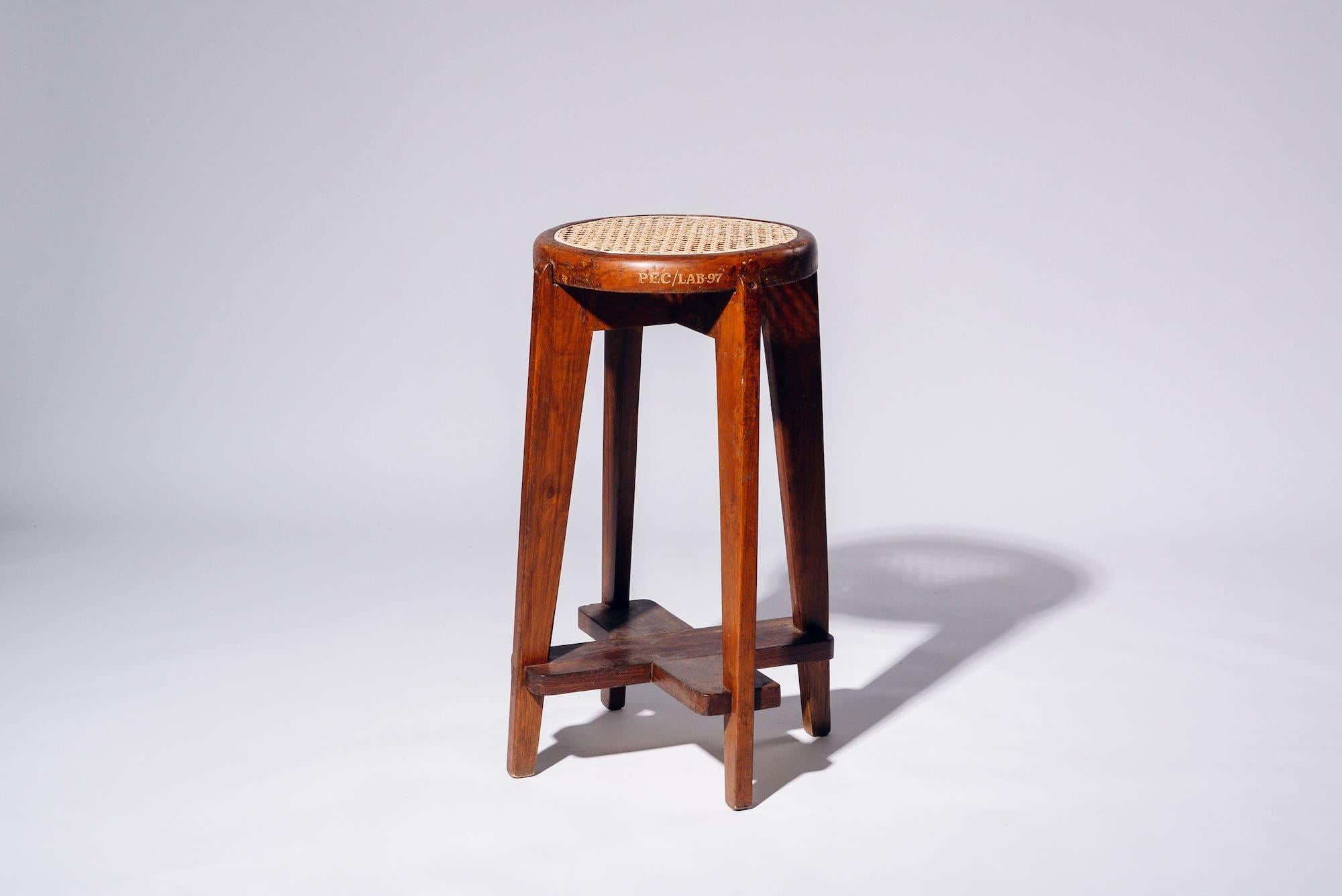 An authentic mid-century piece from Pierre Jeanneret’s legendary Chandigarh commission. Teak frame with hand-woven bamboo-rattan seat.

Letter : PEC/LAB-97 (Punjab Engineering College/LAB N° 97)