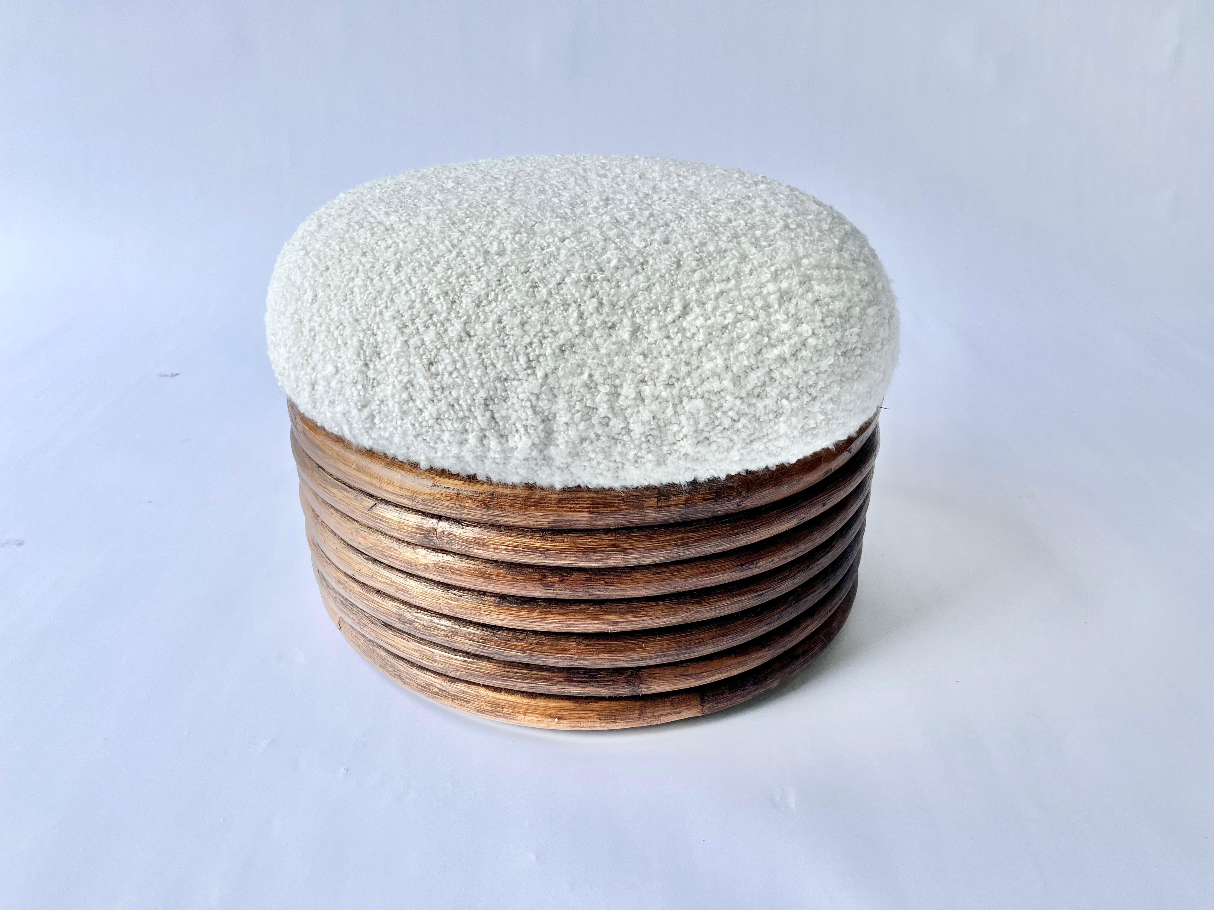 Round Rattan Ottoman, white Kravet Ivory Nubby Boucle fabric seat. Ready for a new home.