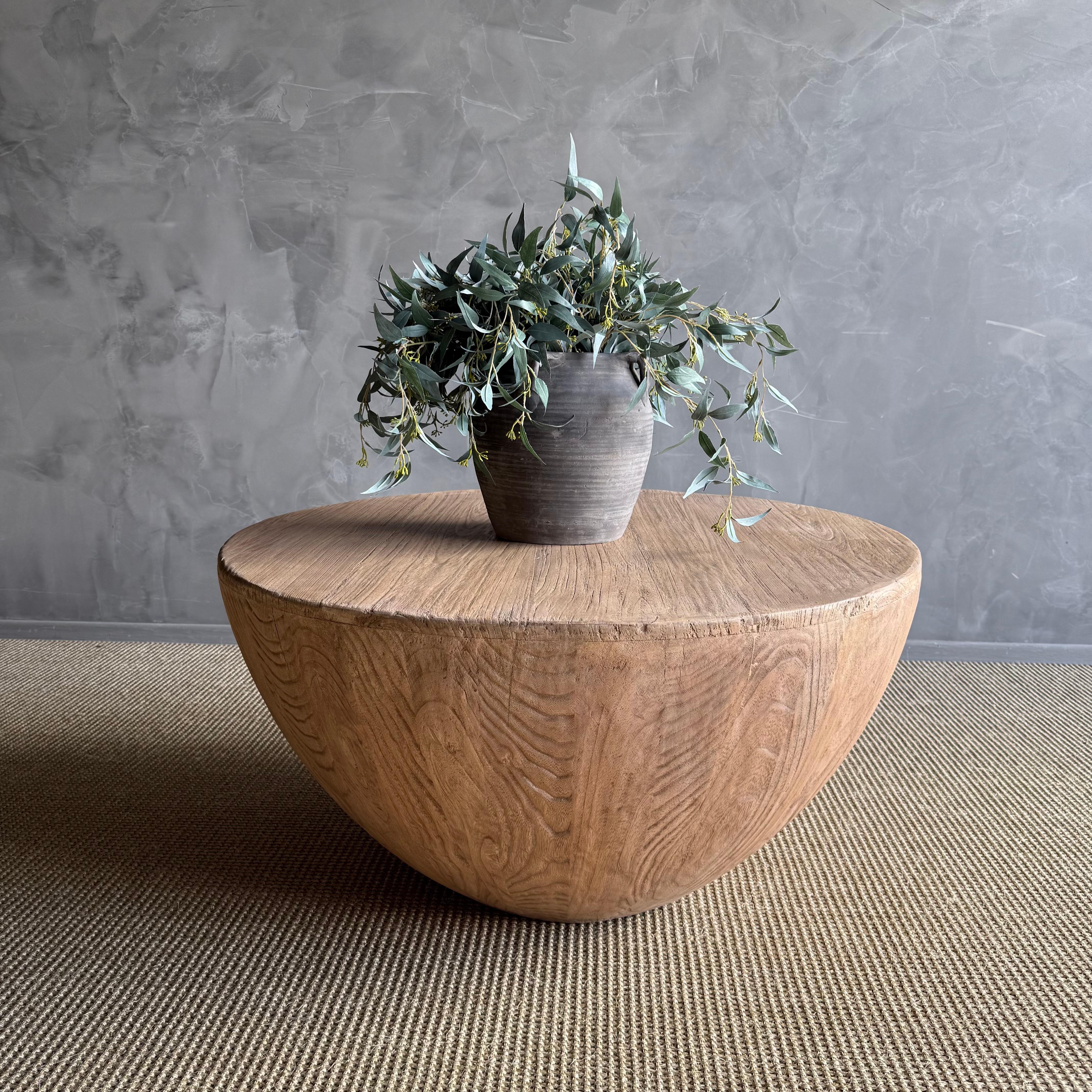 Experience the rustic allure of a reclaimed elm wood coffee table, intricately designed with distinctive features that narrate its own history. The wabi sabi reclaimed grace of this item infuses a touch of heritage and personality into your home,