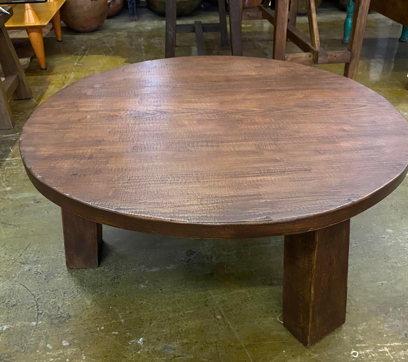 This round coffee table was built using reclaimed Douglas fir. It has three legs and a natural wax finish. Old nail holes and surface cracks may be part of the finish. Please see close up photos