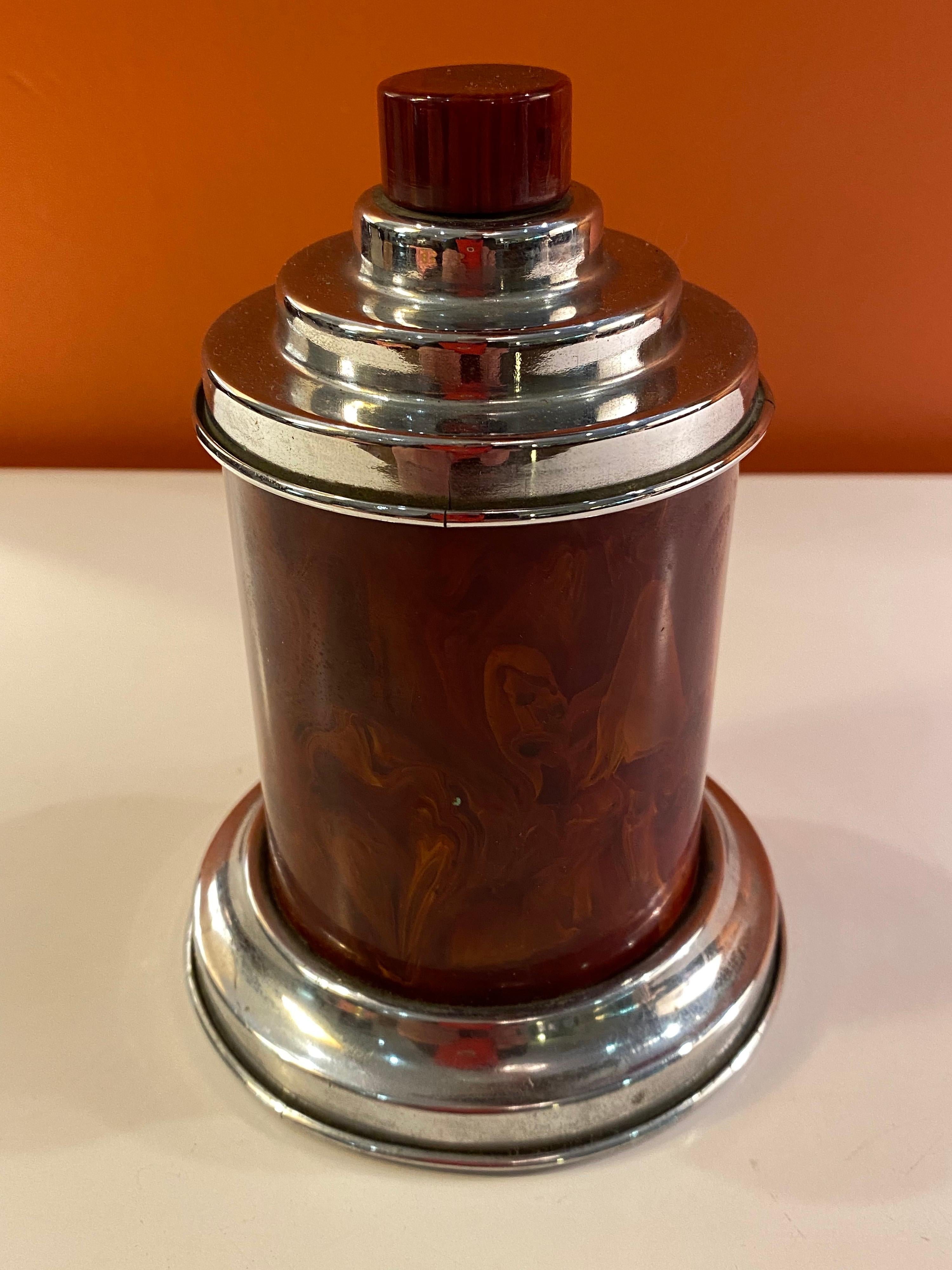 Round red Bakelite cigarette dispenser. Unique design, to open pull up on top red Bakelite Knob to reveal chrome stems that hold your cigarettes. Very nice original condition. More often found in a butterscotch color. Red is an uncommon example.