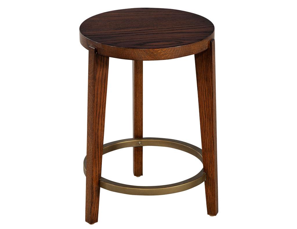 Round Red Oak and Brass Drinks Table by Ellen Degeneres Fife Table. Round oak drinks table with unique brass ring design. Finished in a natural rich satin brown. Price includes complimentary curb side delivery to the continental USA.