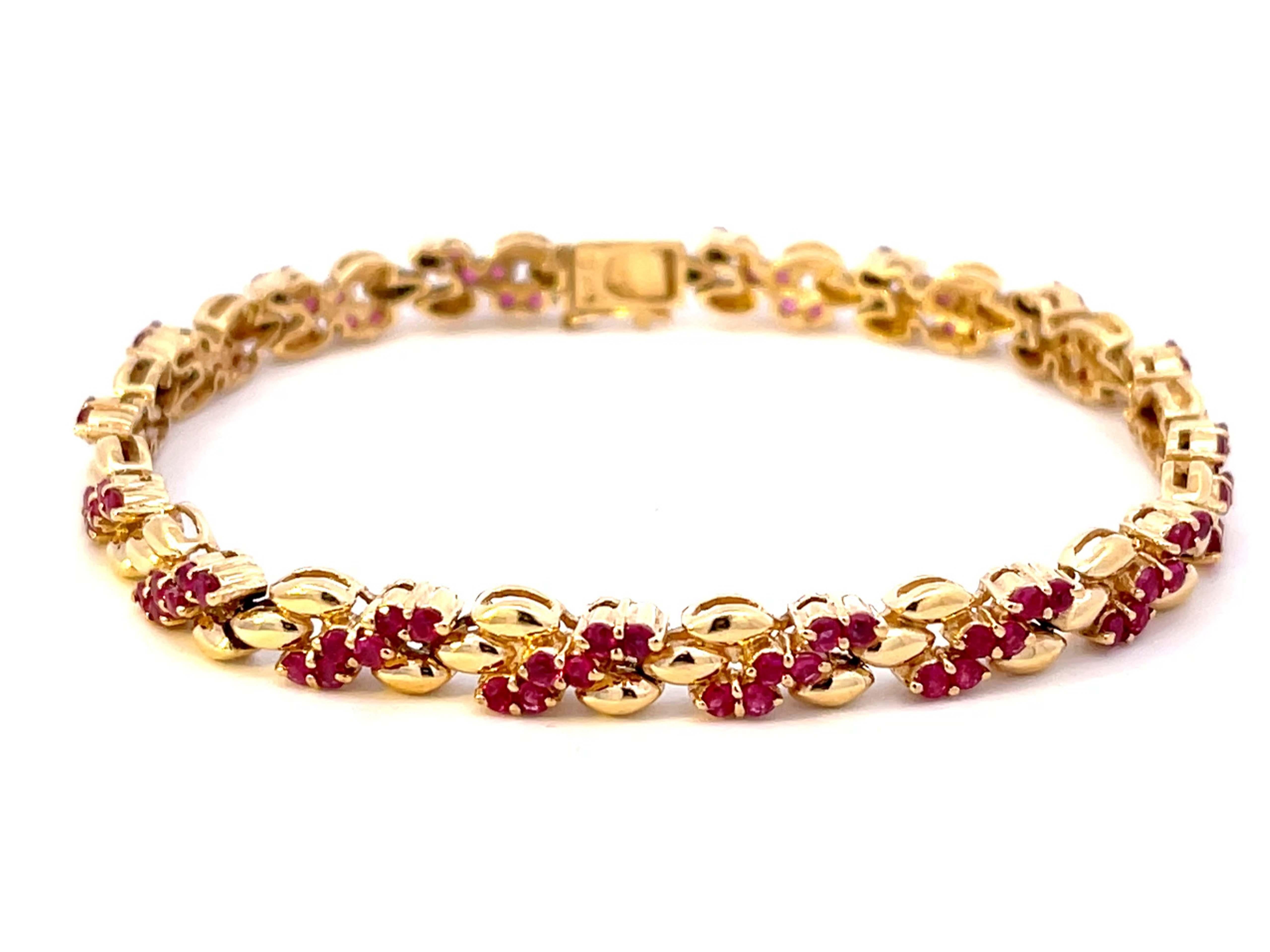 Bracelet Specifications:

Metal: 14k Yellow Gold

Gemstones: red rubies 

Red Ruby Carat Weight: 2.80 carats

Red Ruby Count: 96

Bracelet Length: ~6.5 inches

Bracelet Width: ~ 5.68 mm

Total Weight: 13.6 Grams

Condition: Vintage,